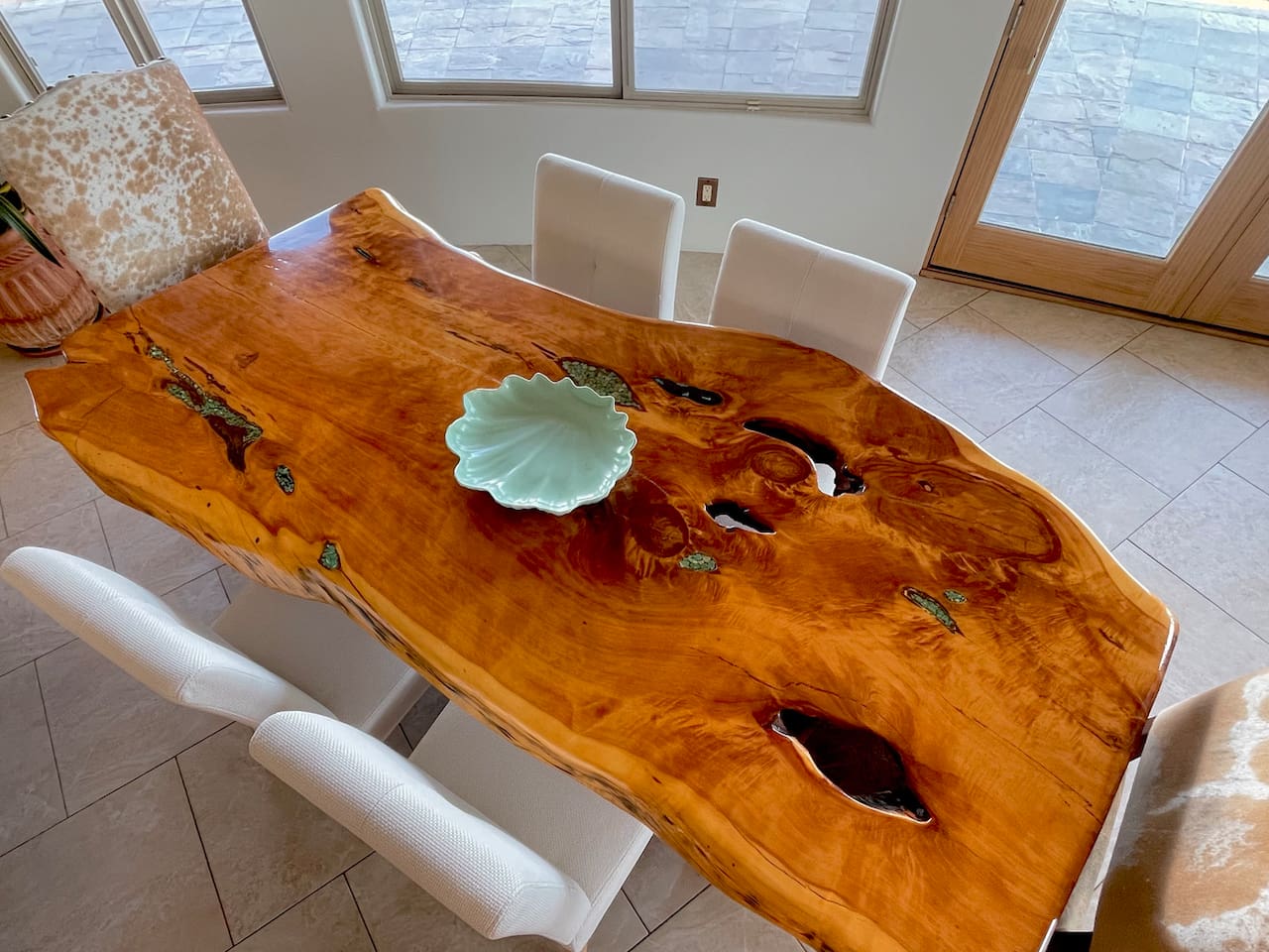 The natural wood dining table brings warmth and character to meals shared around the table.
