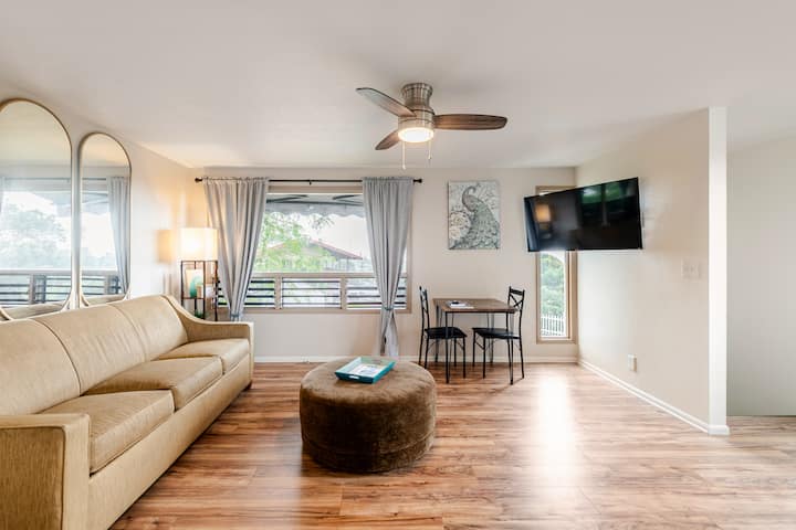well lit living room with ocean views