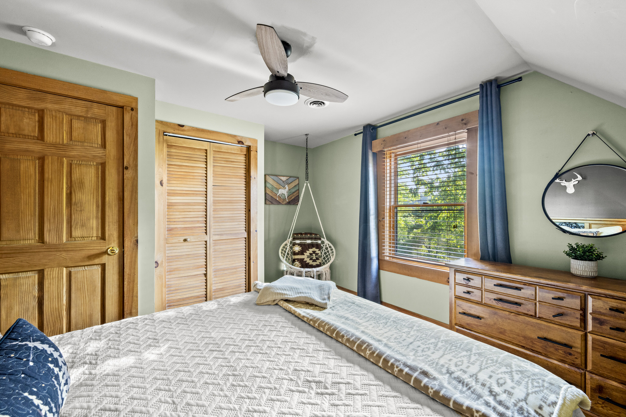 Relax and recharge in this upstairs bedroom with queen bed