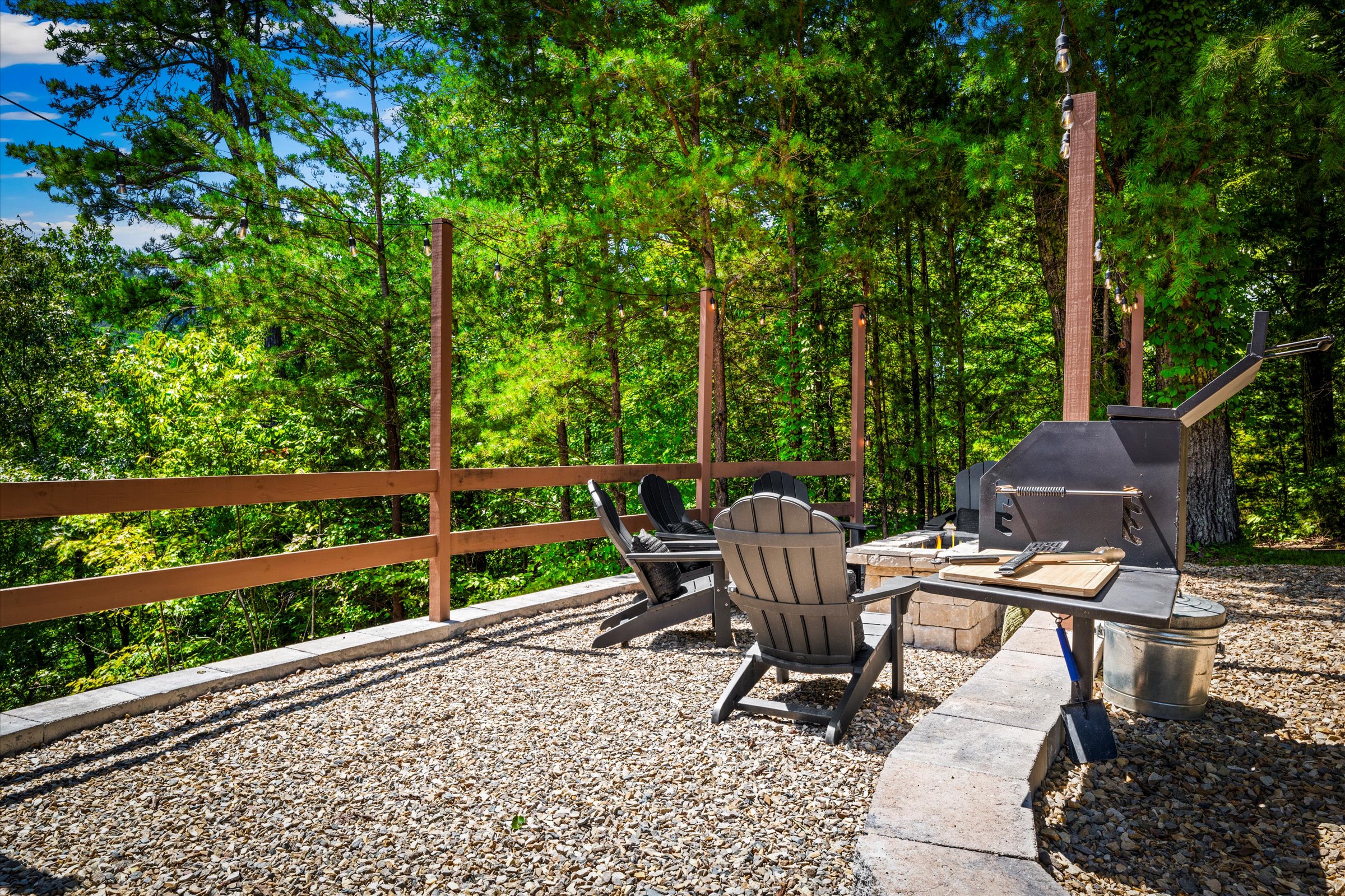 Gather around the propane fire pit under twinkling string lights for the perfect night in.