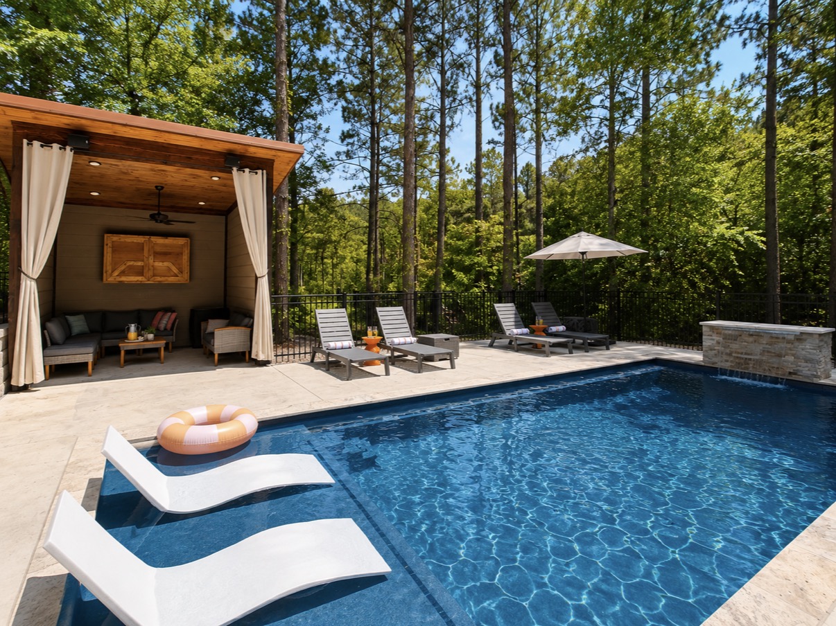NEW! Resort style heated pool surrounded by towering pines with a spacious tanning ledge, luxury in pool loungers, private cabana lounge, and plenty of space to relax after a day exploring Broken Bow.