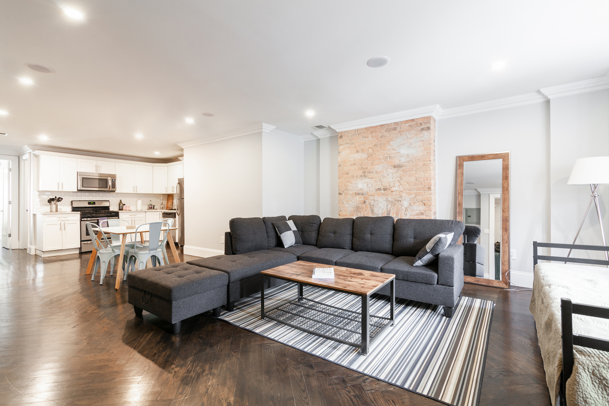 Perfect for families, couples, and friend groups. Main living area with full kitchen and modern appliances. Living area has a sectional sofa, full sized daybed, and 55 inch flatscreen TV.