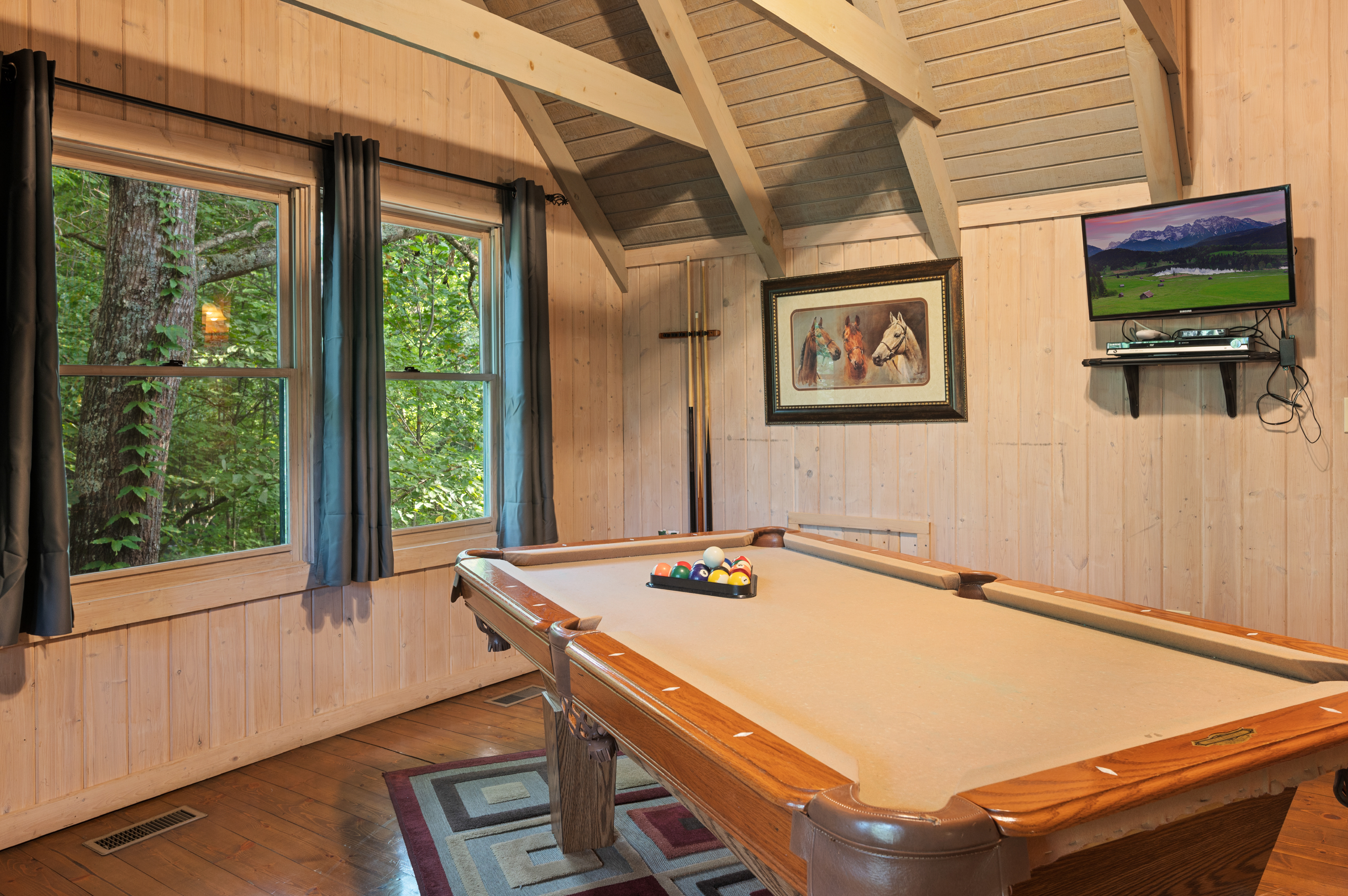 Enjoy endless fun in the loft game room with a pool table and a view!