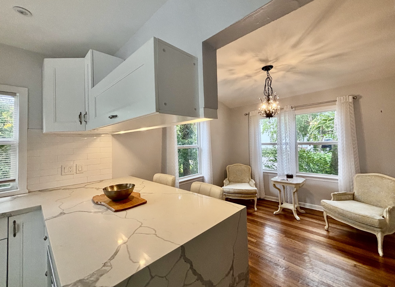 The sitting area off the main kitchen is cozy and well-lit, a wonderful little nook to relax in.