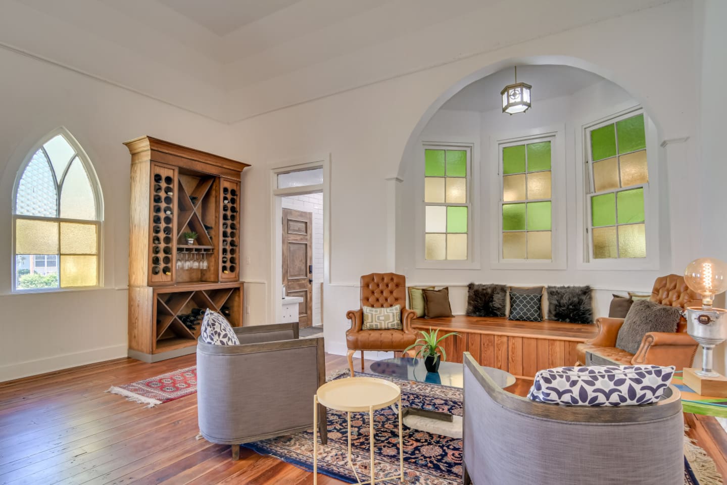 Spacious living room with vaulted ceilings and vintage rugs.
