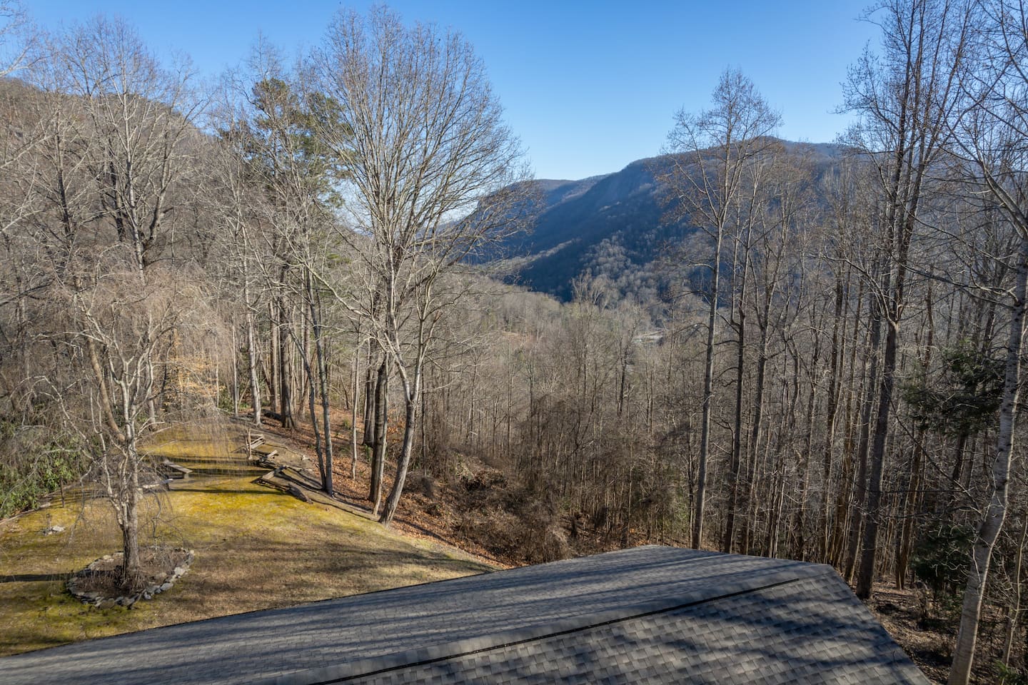 Upper view above the home and the surrounding mountain views