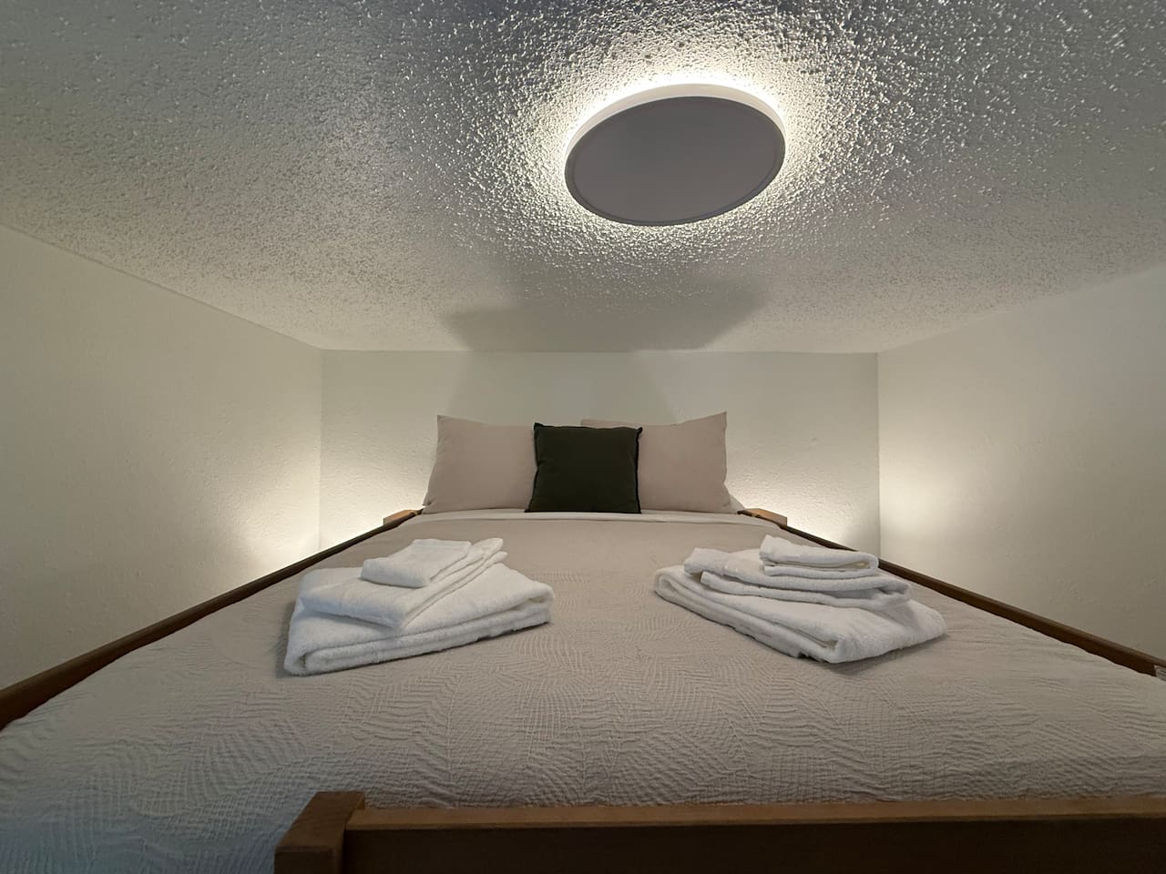 The top bunk offers a snug and cozy sleeping experience, perfect for winding down after a day of mountain adventures.