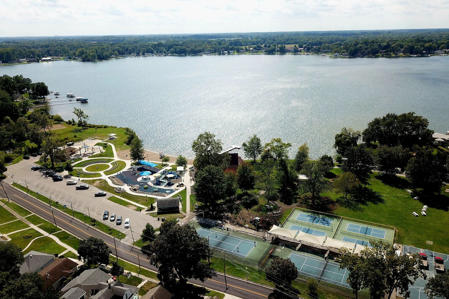 Winona Lake Limitless Park – tennis and pickleball courts, a splash pad, a playground, beach area, pavilions and tables for picnics, and lots of beautiful trees and grassy areas just .3 miles away from Wanderer's Rest.