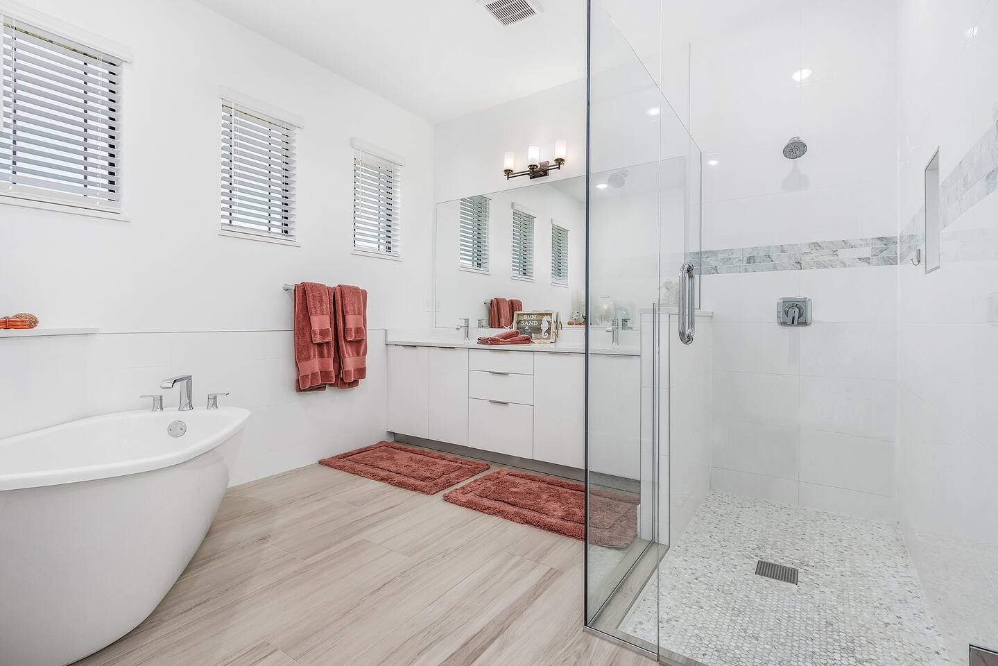 Luxurious primary ensuite bathroom featuring a freestanding tub, walk-in shower, and dual sinks—your perfect sanctuary for relaxation and rejuvenation.