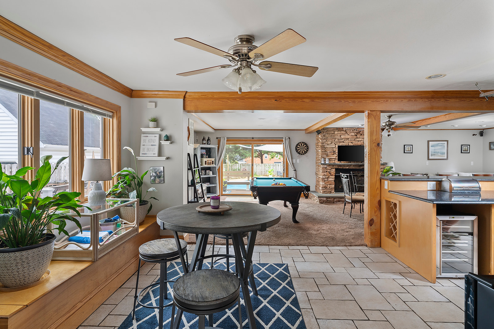 Living Room & Kitchen Open Layout: Bright and open space with pool table, perfect for fun gatherings and relaxation!