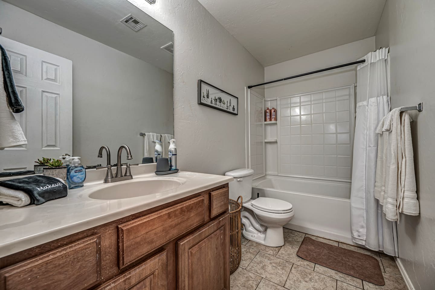 Enjoy the convenience of a shower/tub combo and walk-in closet in this Master bathroom.