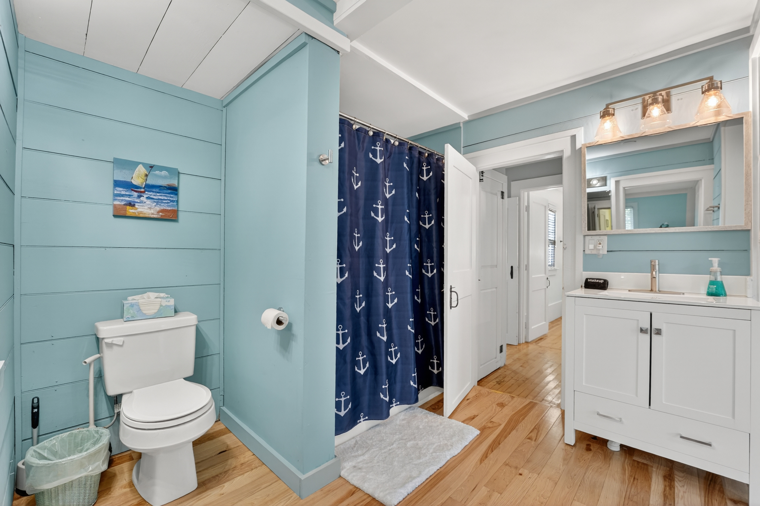 Full bathroom with a shower and vanity, offering plenty of space to get ready for the day.