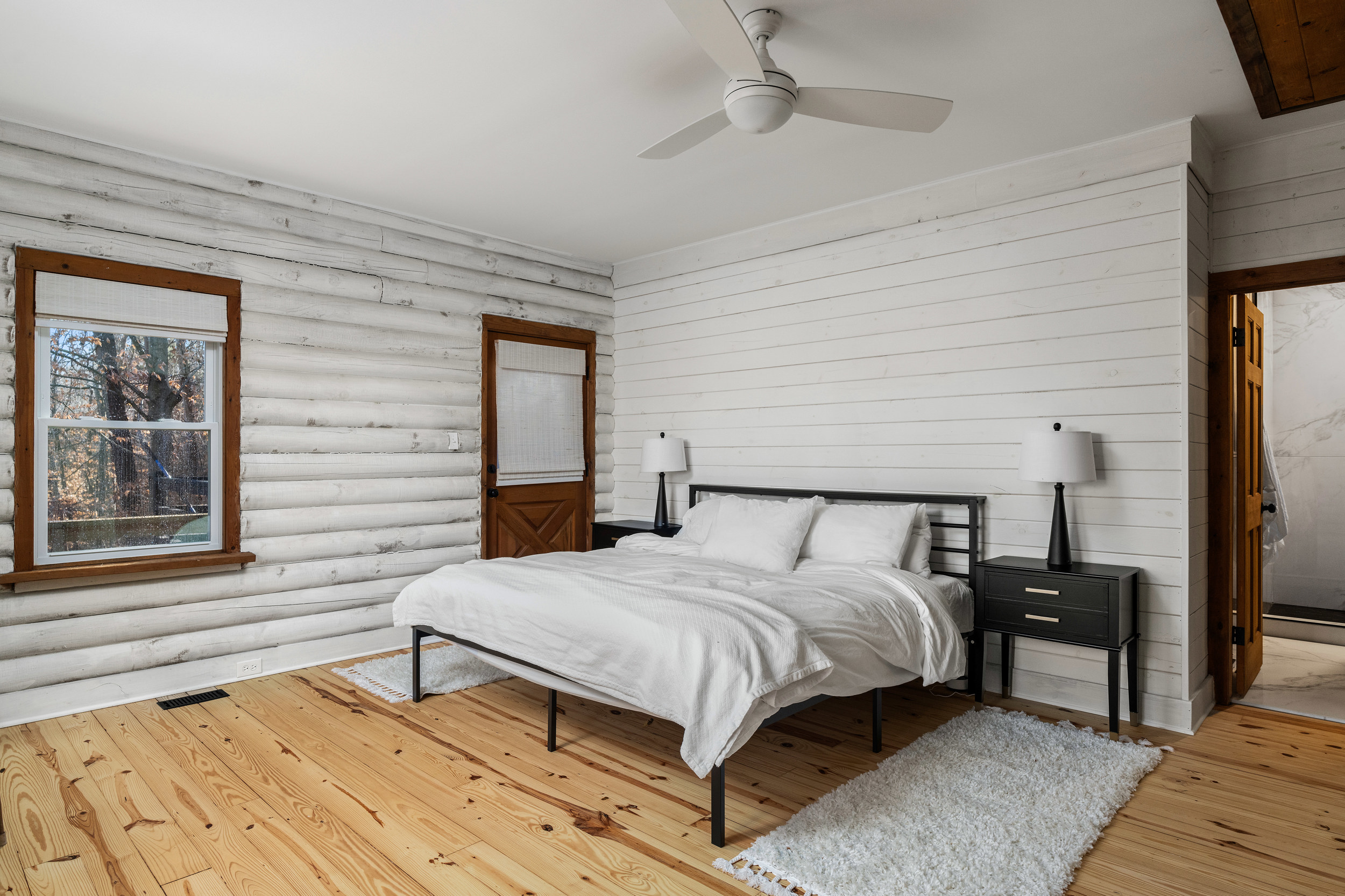 Bedroom 1: Crisp linens, natural light, and rustic decor make relaxation a breeze!
