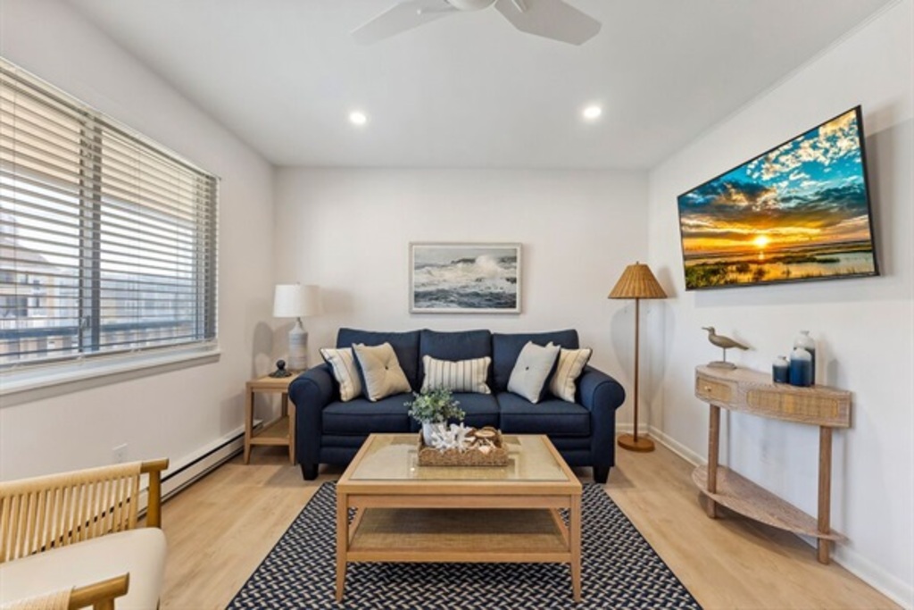 Comfortable living space with seating and a TV.