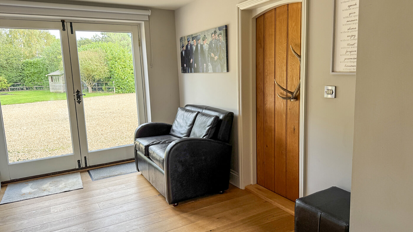 Games room additional seating and external door.