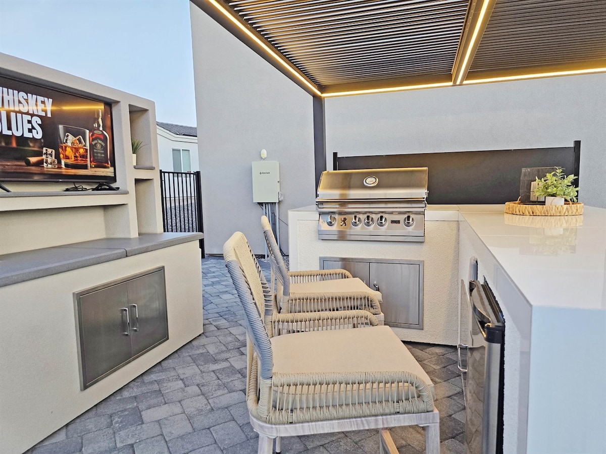 Outdoor kitchen and lounge w/ Lion BBQ.