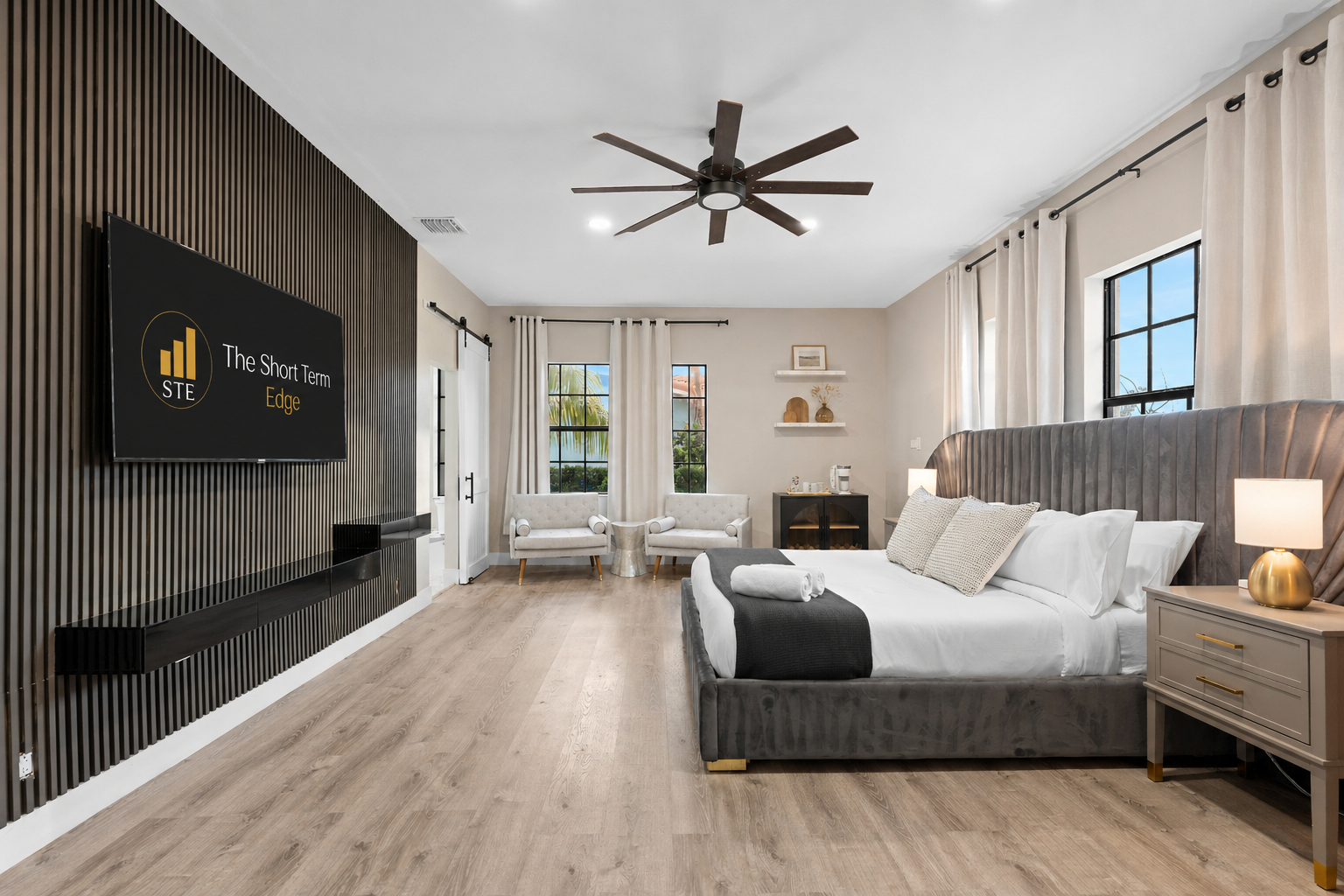 🛌 Downstairs master suite with 65" TV, cozy chairs, and your own coffee station to start off each day.
