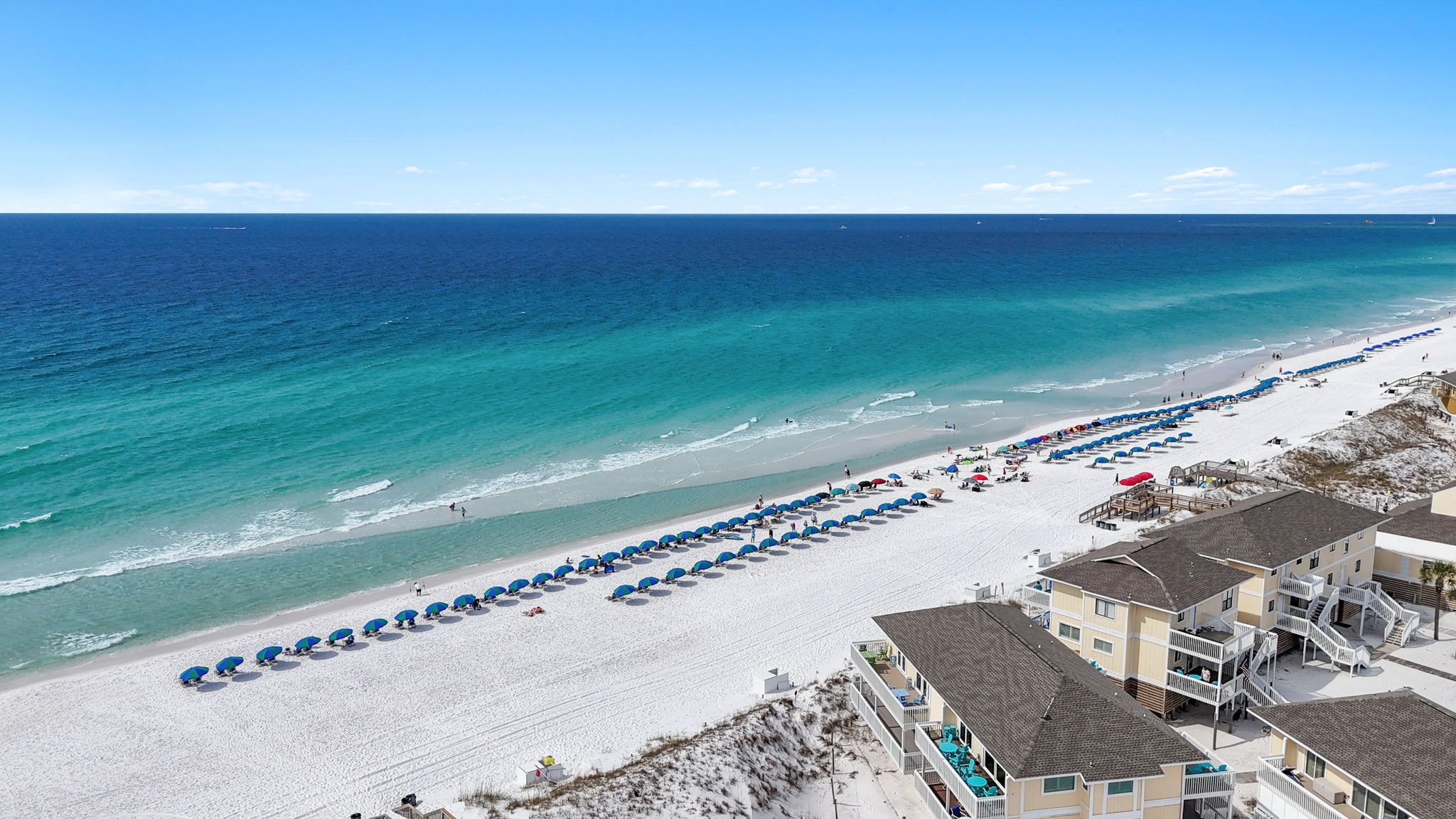 Your beach day just got easier! 🏖️ Once you finish your walk down the private boardwalk, look for the red umbrellas. Your stay includes professional beach service.