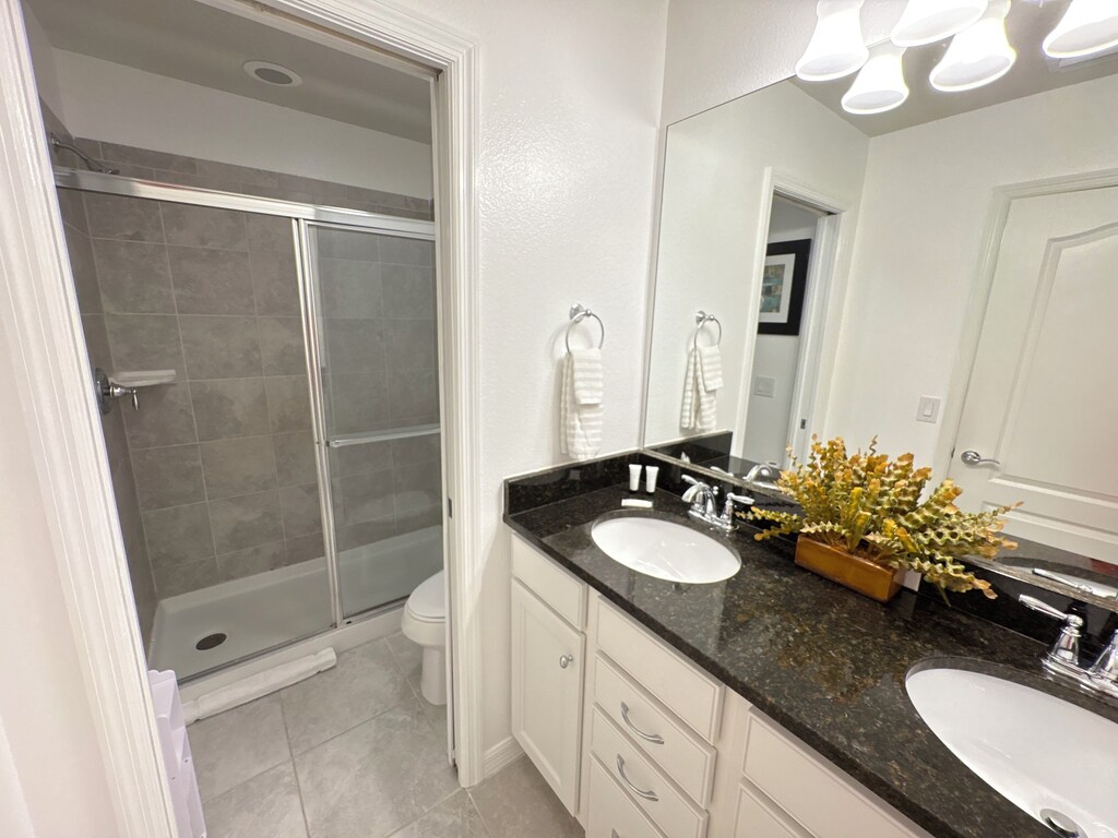Second floor bathroom with separate stall for the shower and toilet