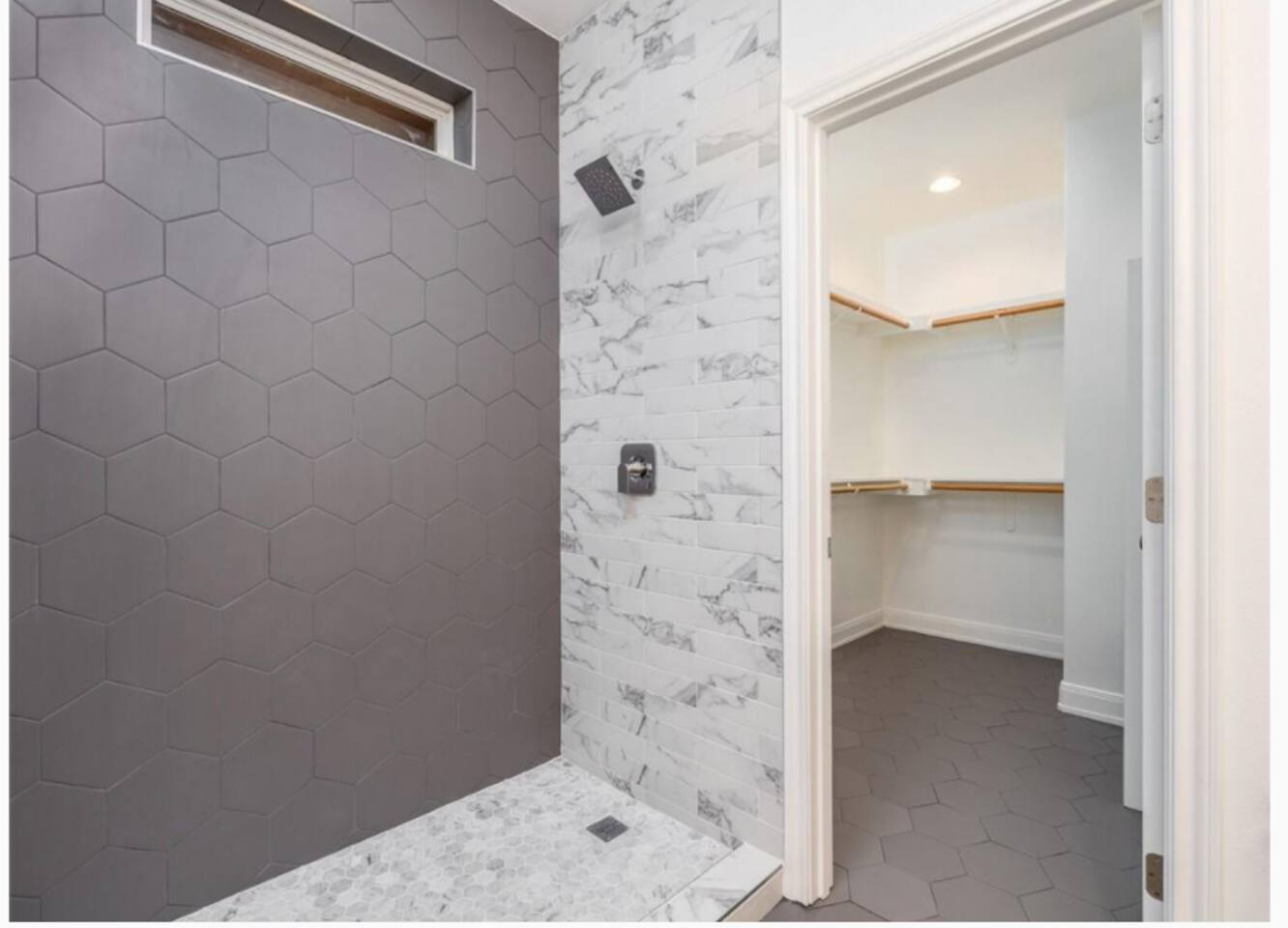 Stand up shower and a spacious walk in closet.