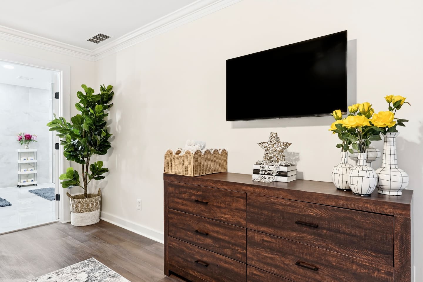 Beautiful second-level master bedroom featuring a king bed, a Roku-powered Smart TV, located all the way to the right at the top of the staircase. This room includes 2 full-body towels, 2 washcloths, and 2 hand towels for your stay.