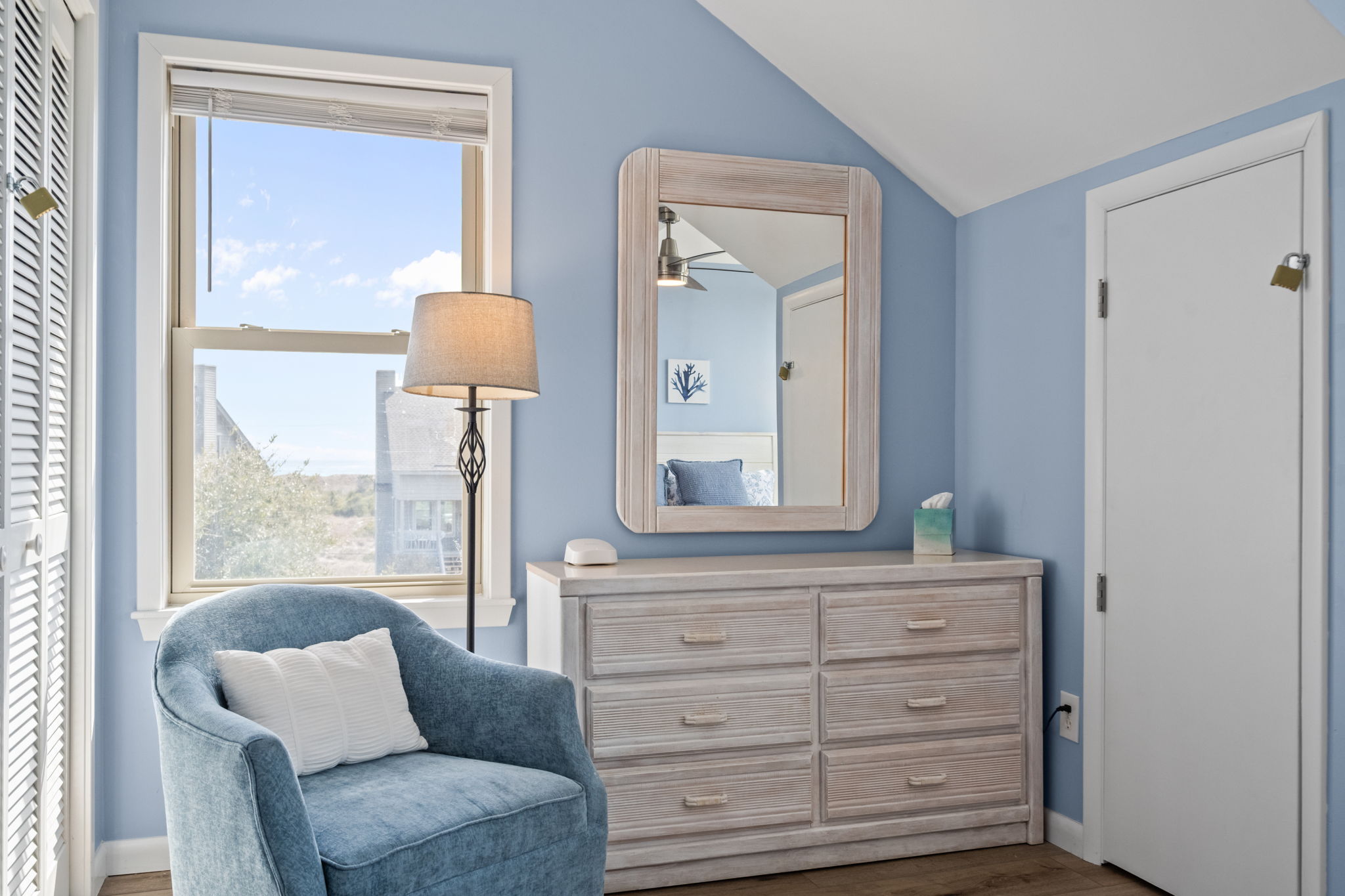 A perfect mix of style and convenience, with a cozy chair for reading or relaxing and a dresser to keep everything neatly tucked away.