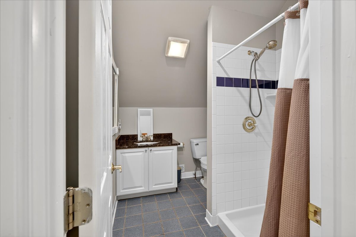 Convenient full bath with walk-in shower.