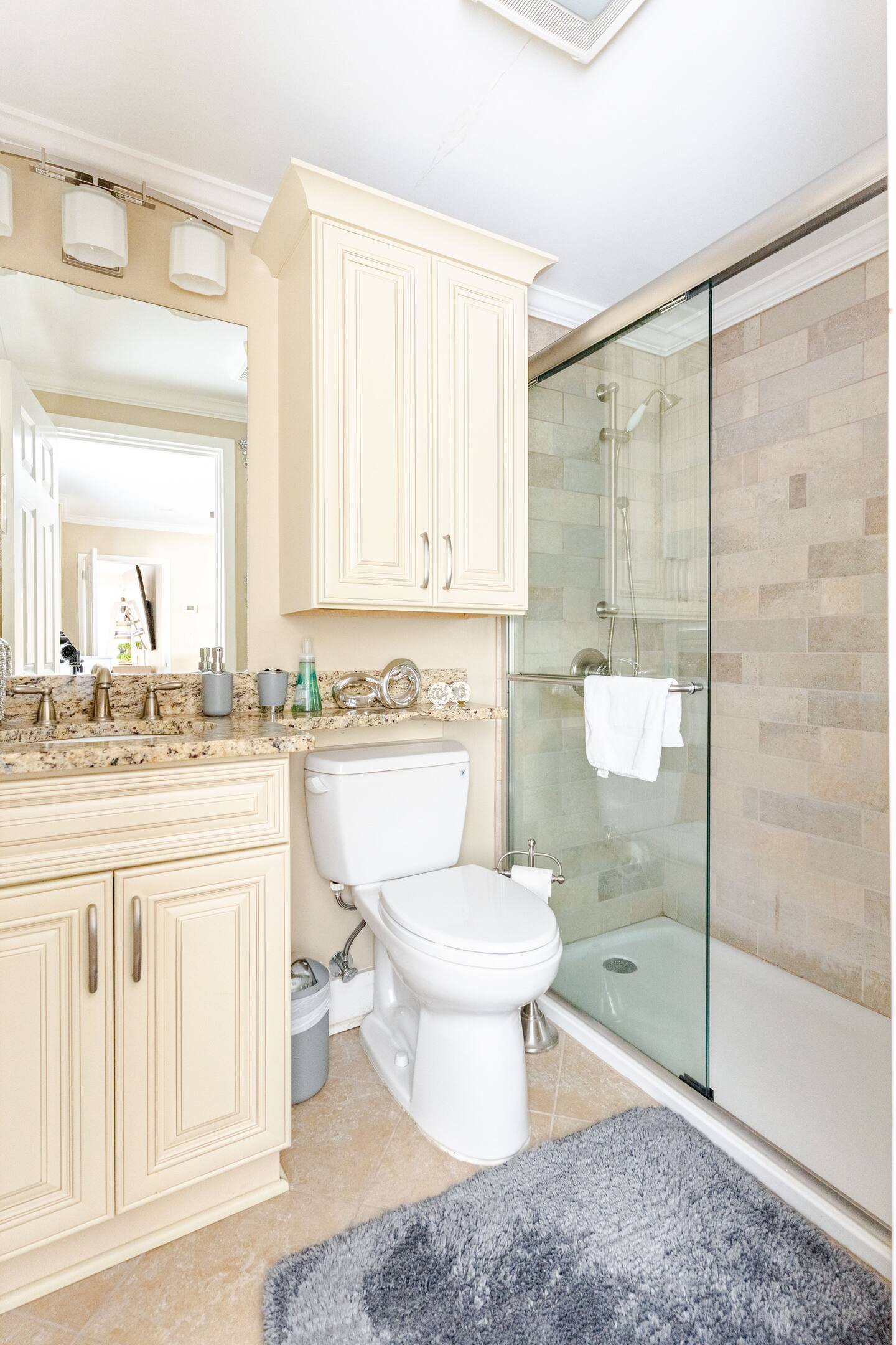 A spacious, beautifully appointed master bathroom designed for comfort and relaxation.