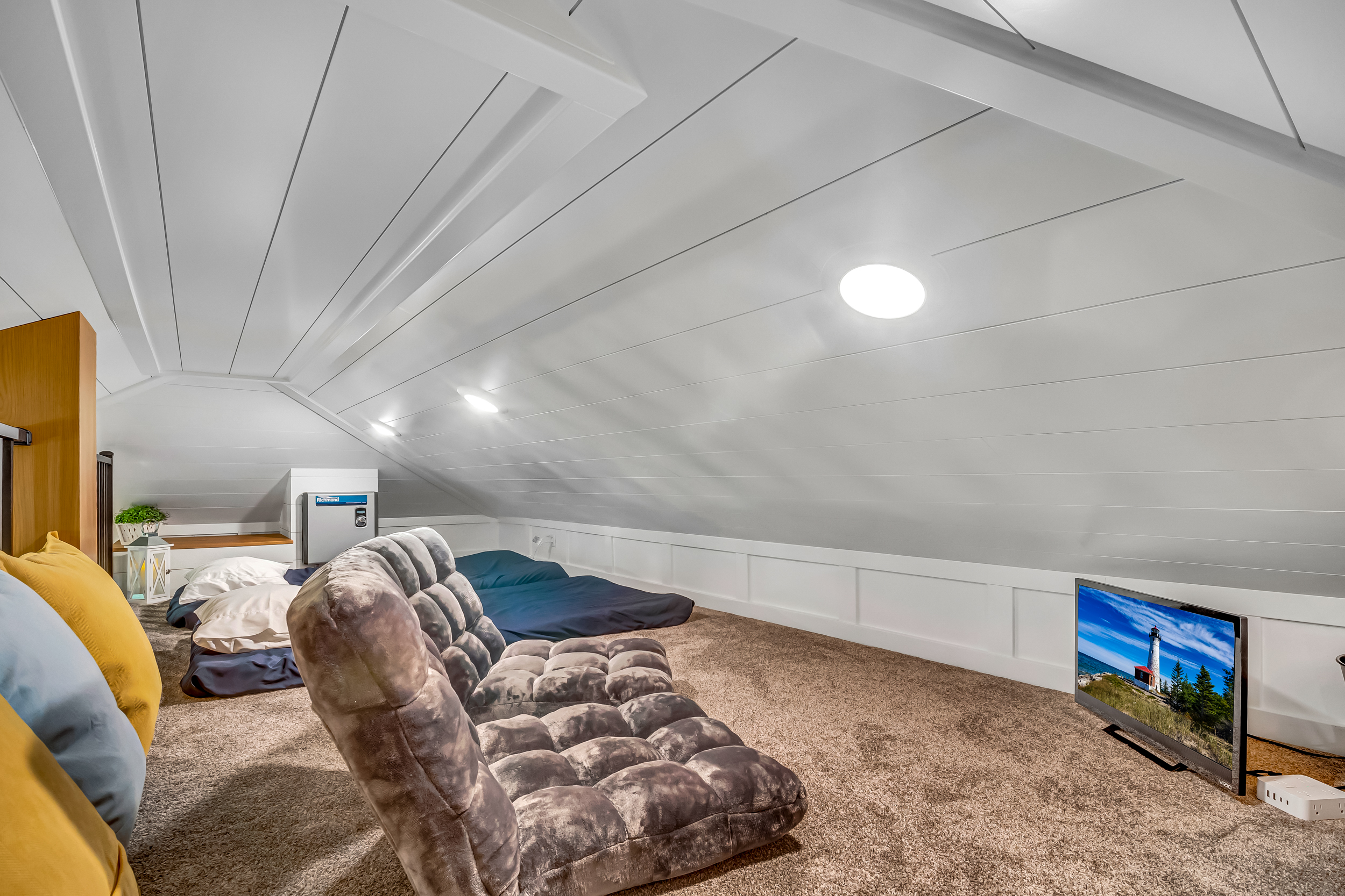 Loft has 2 flr mattresses w/ traditional bedding or bring along your sleeping bags. Fan is also available for additional temperature control. Ceiling is low, not high enough to stand fully.