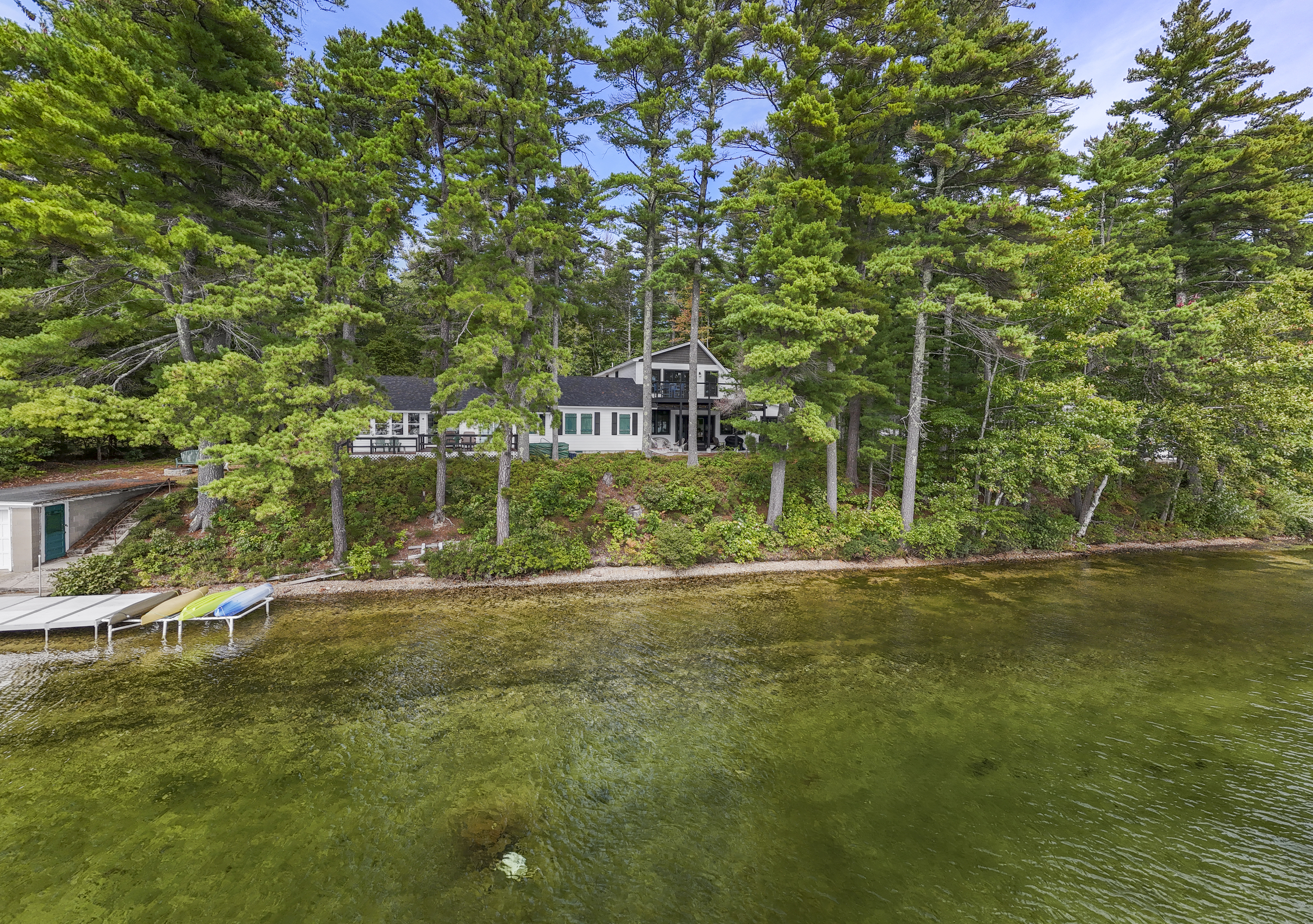 Tucked beneath the pines and right at the water’s edge, your Great East Lake escape is exactly where it should be.