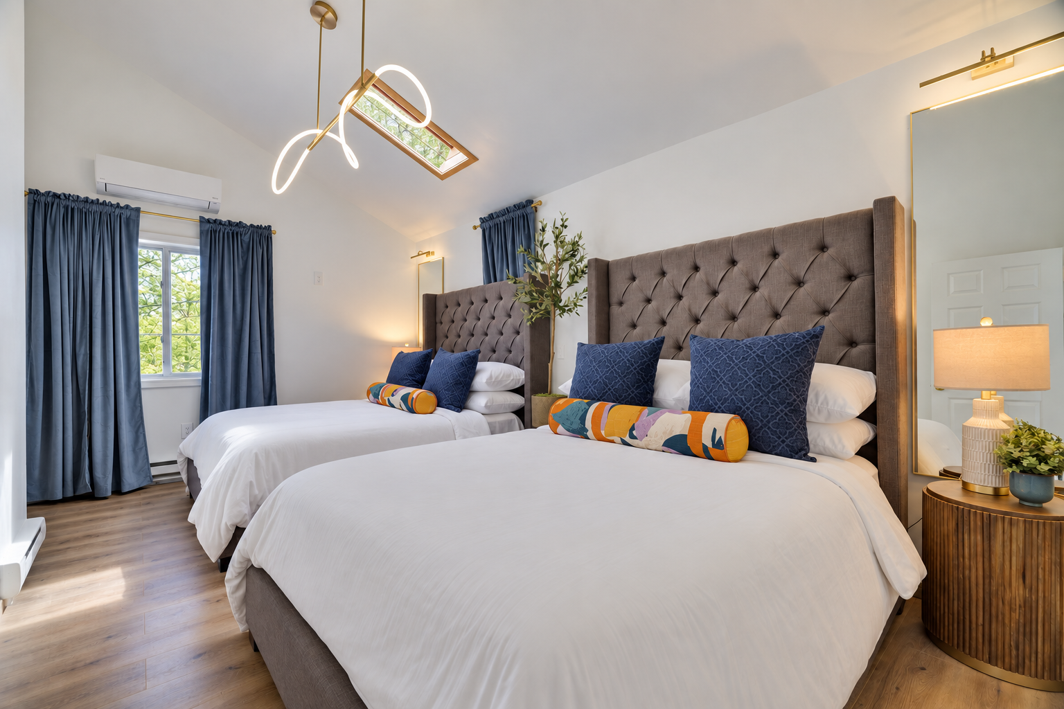 Bedroom 3 - Ideal for families or groups, this roomy bedroom offers two queen-size beds, a skylight, and a 55-inch Smart TV. Access from the second-floor family room.
