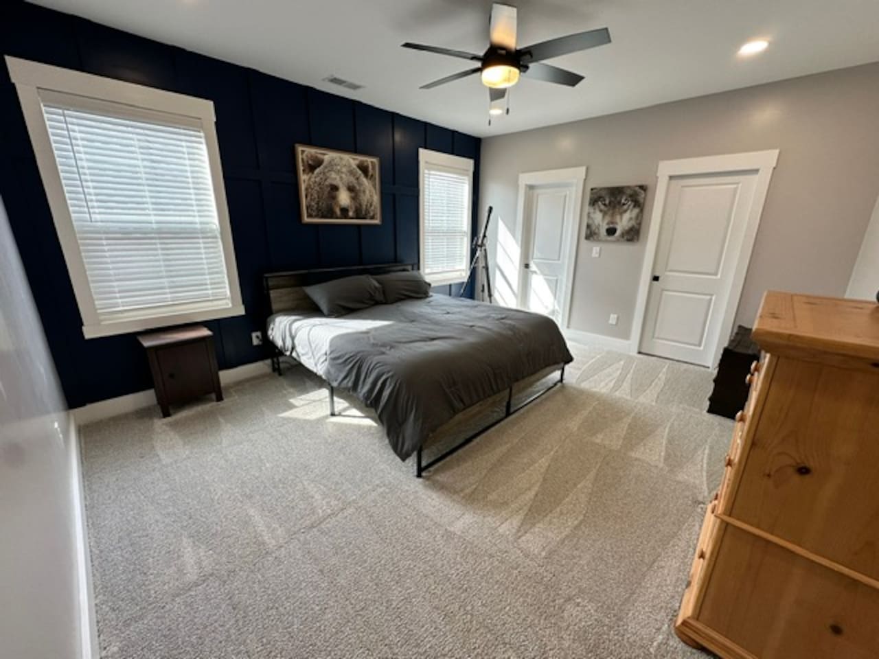 Large bedroom with private sink and shared access to private shower/toilet rooms with bedroom #2. Quaint under stair nook on opposite wall. 