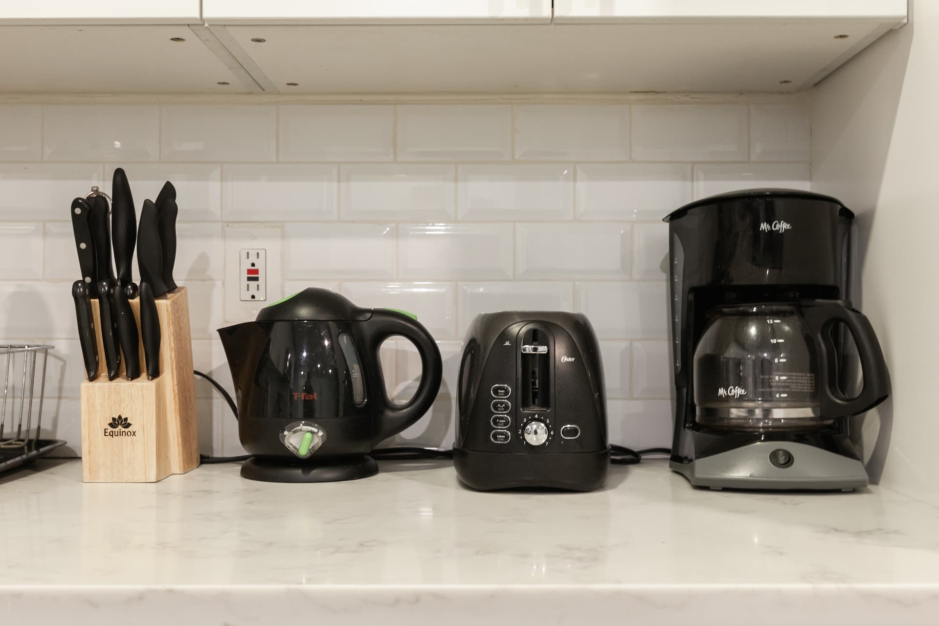 Electric kettle, coffee machine, and toaster oven. 