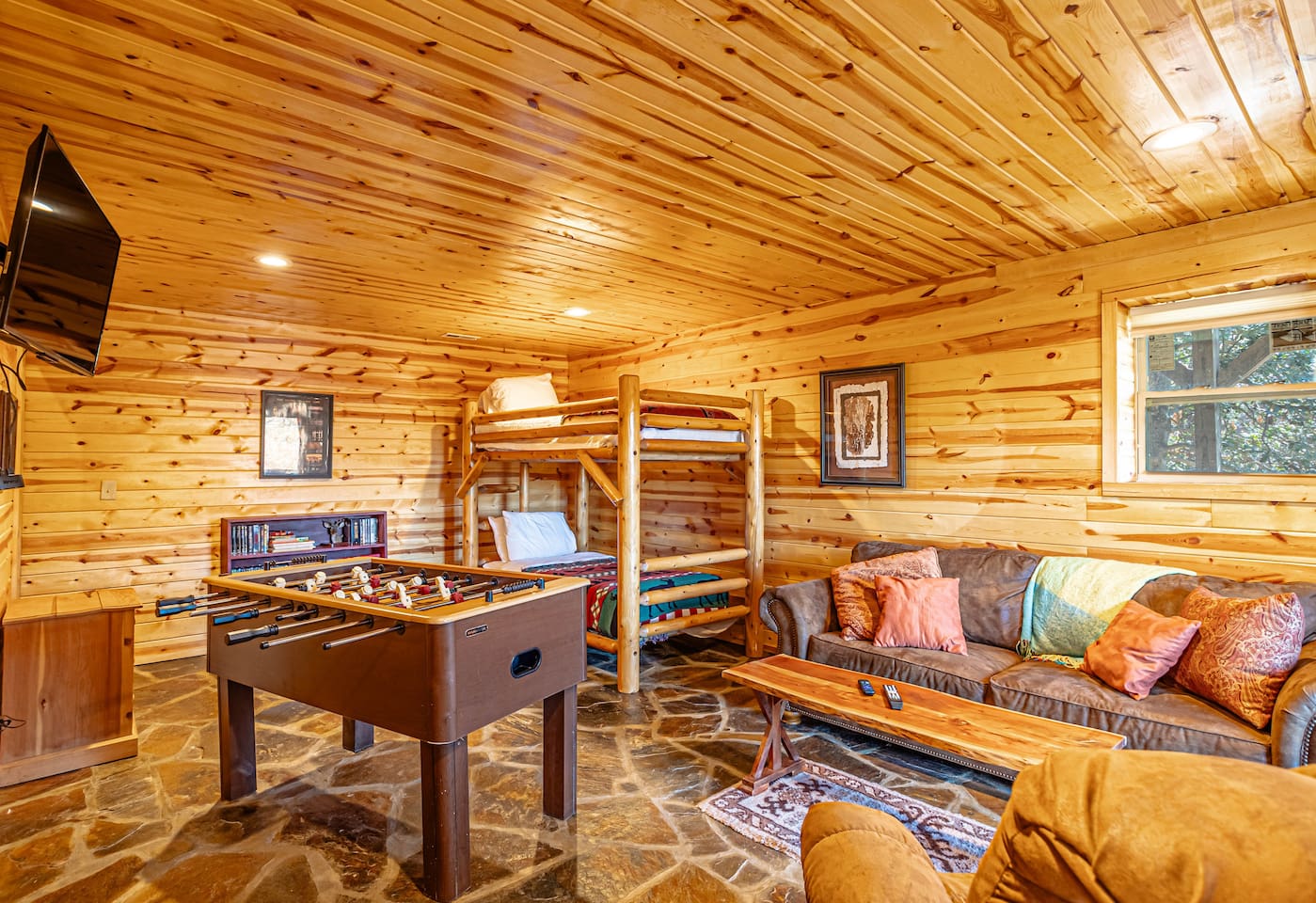 Lower level open living room/ bunk bed room with French Doors to lower, fully enclosed deck. The lower deck also has a gate for entry/exit from lower level.