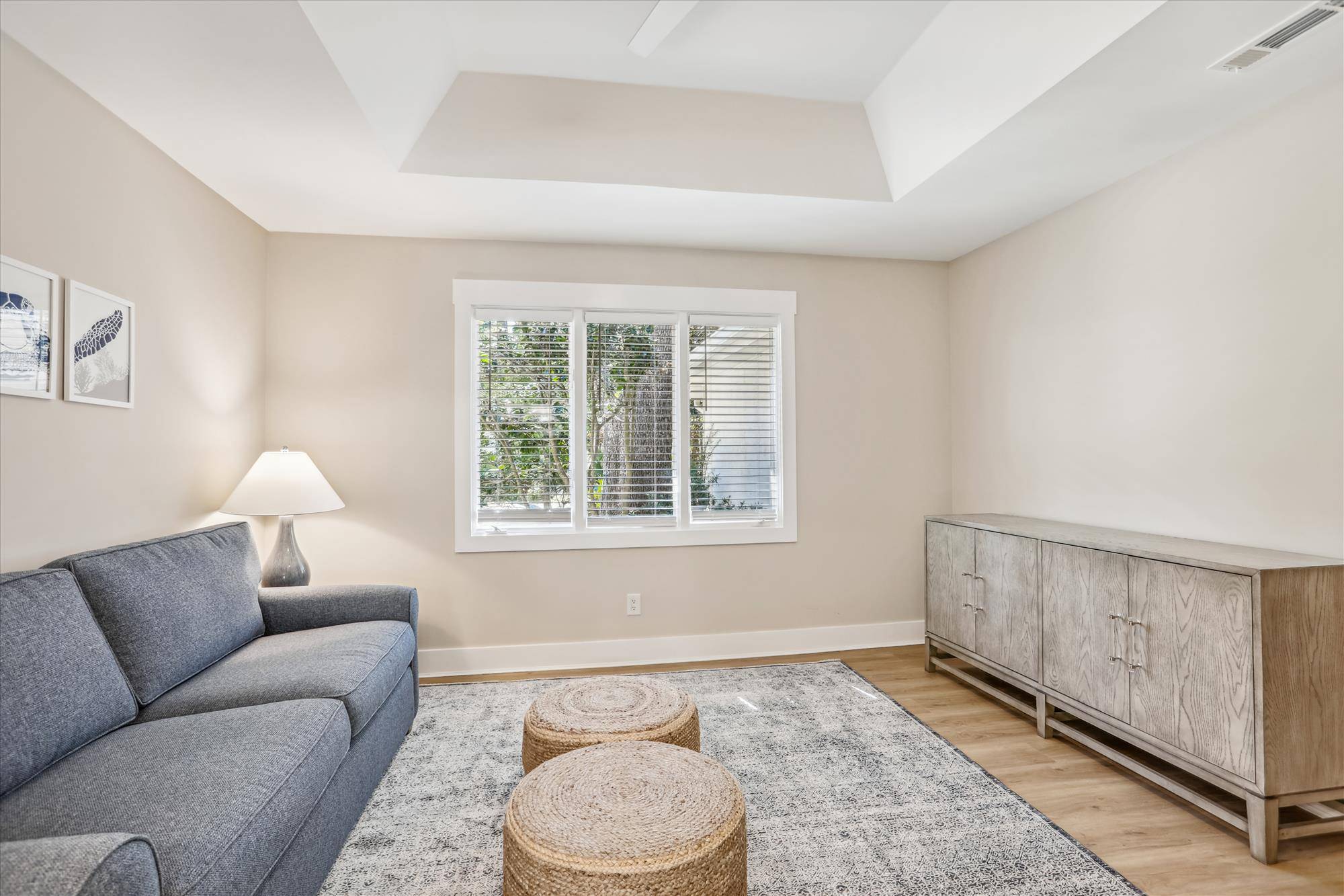 Den off the living room includes a sleeper sofa