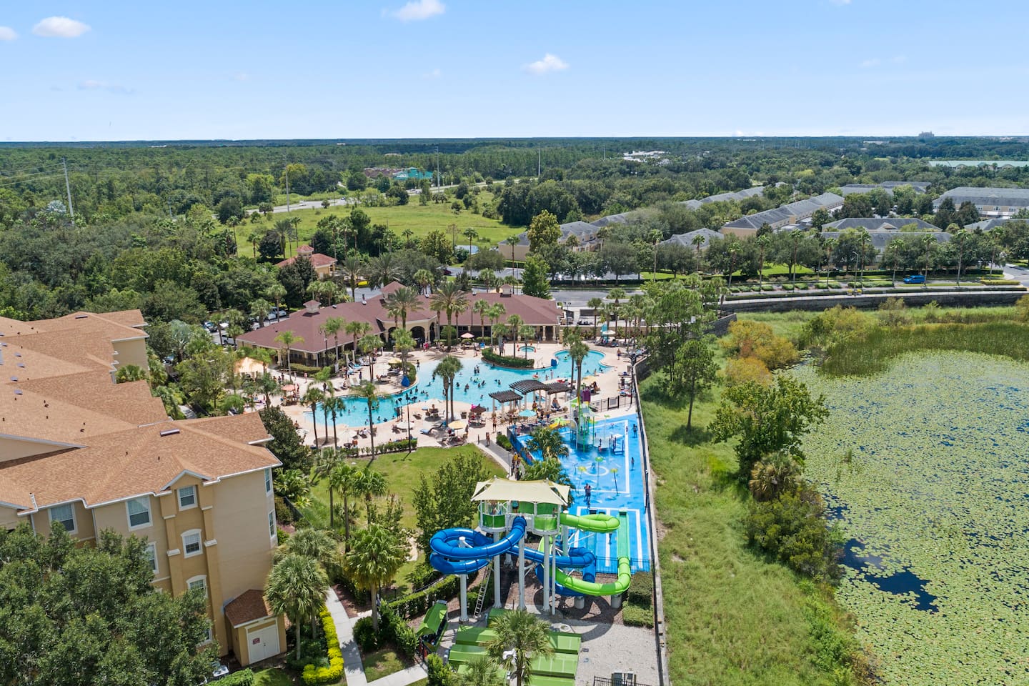 Aerial view of water park slides and resort pool area.

