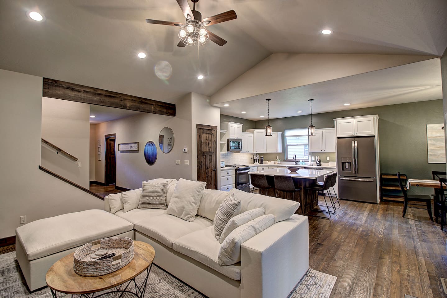 Living room, kitchen, and stairs all flow together here, so nobody's ever too far from the fun (or the fridge).
