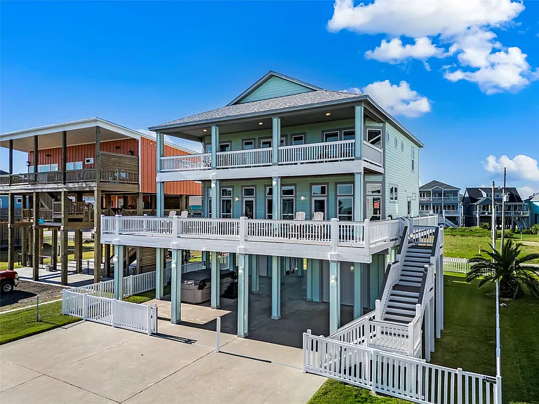 Crystal Paradise Exterior: Here’s a peek of what waits for you—an impressively spacious home with multiple oversized balconies, a private hot tub, and plenty of outdoor space to enjoy those refreshing ocean views from every level.