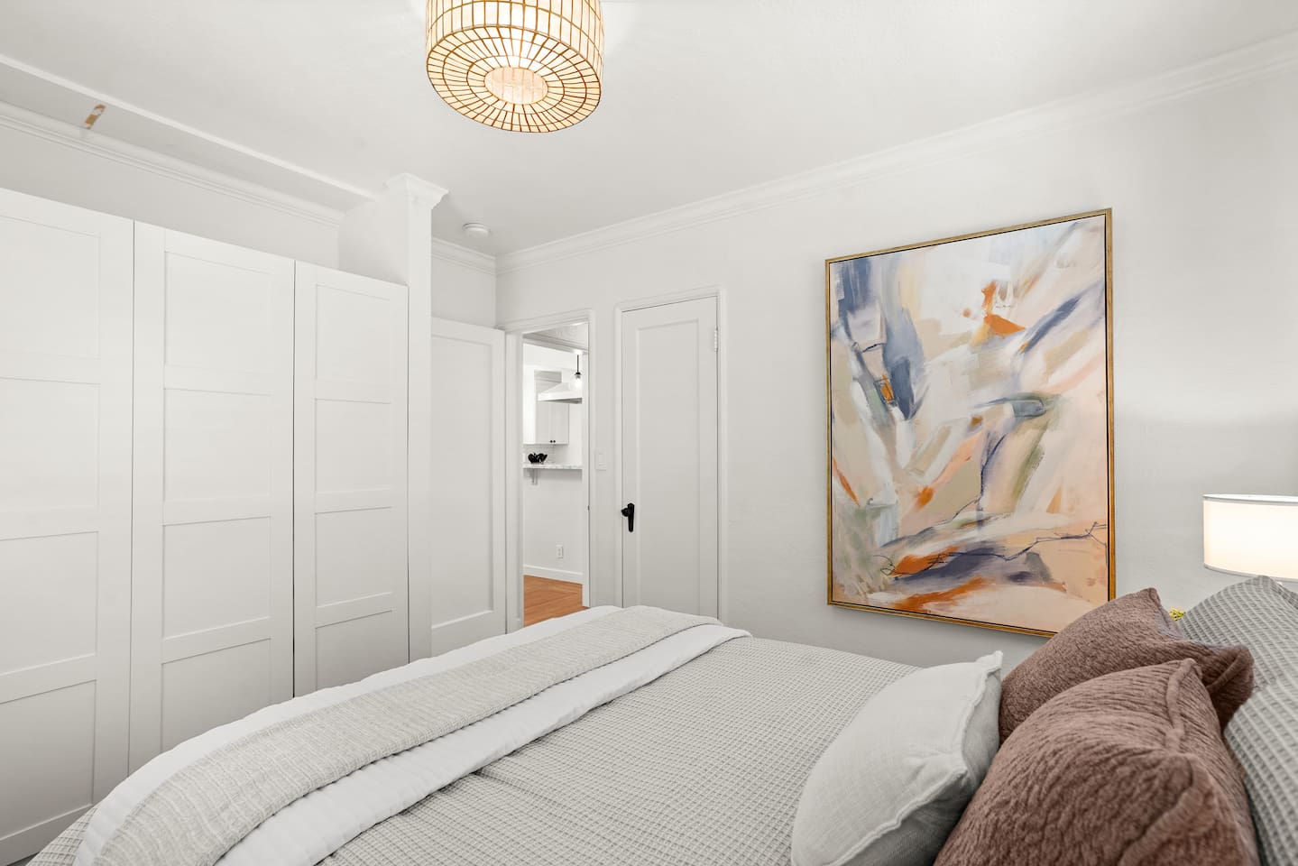 Bedroom 1 features a comfortable queen bed, soft linens, calming decor, and a relaxing space to unwind and recharge.