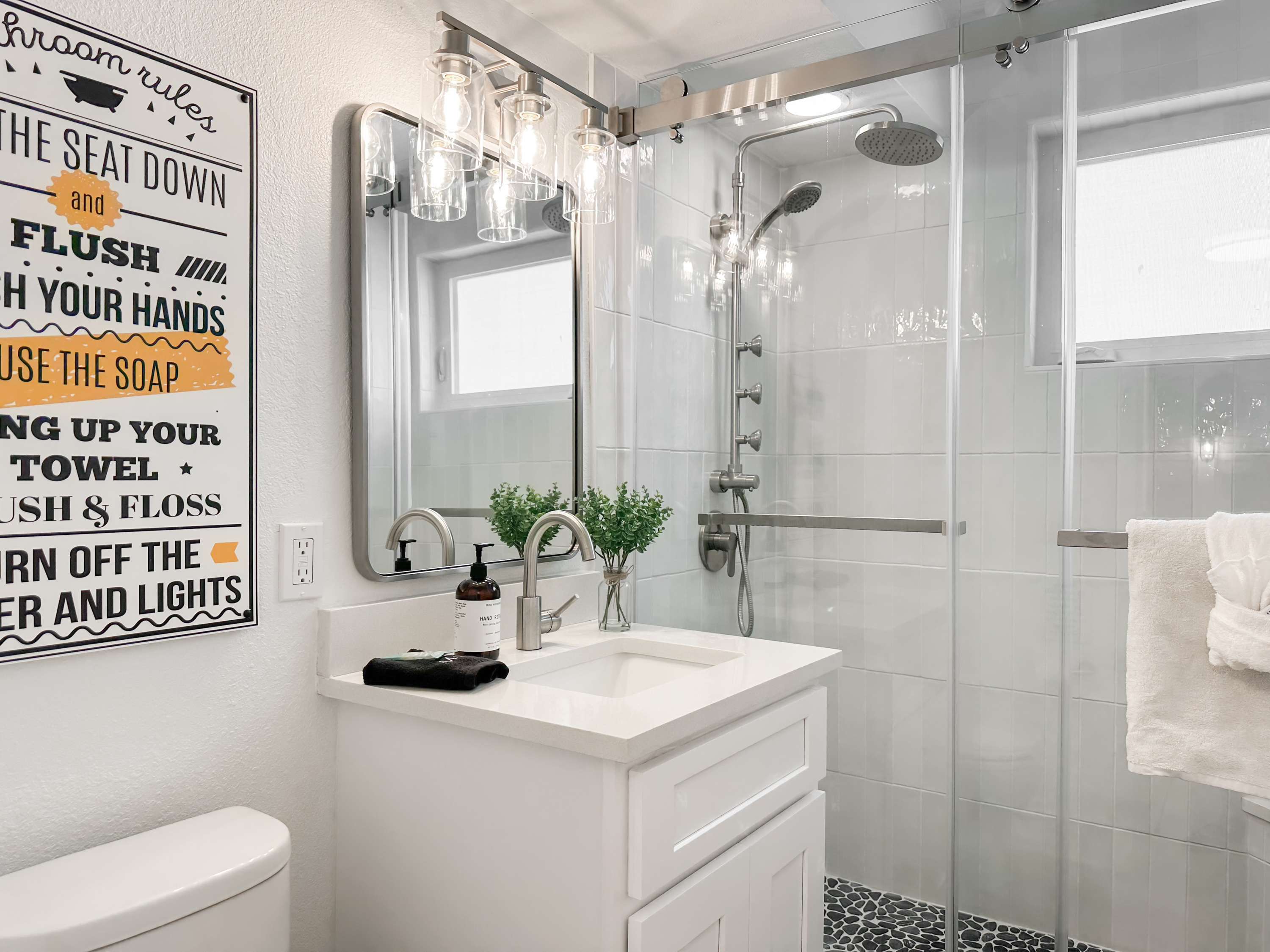 The full bathroom around the corner has a walk-in shower.