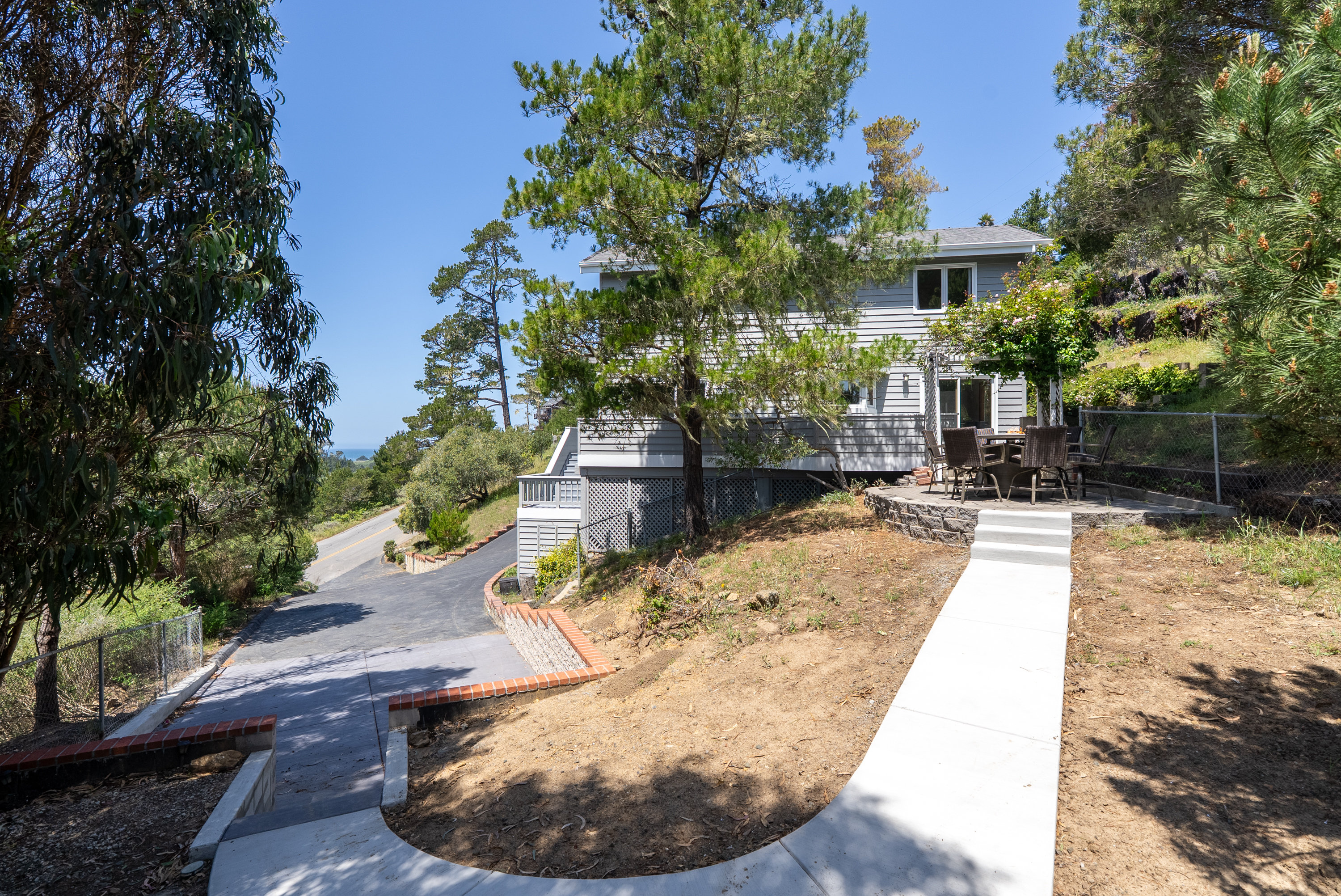 Walk to downtown from this updated home with peak ocean views.