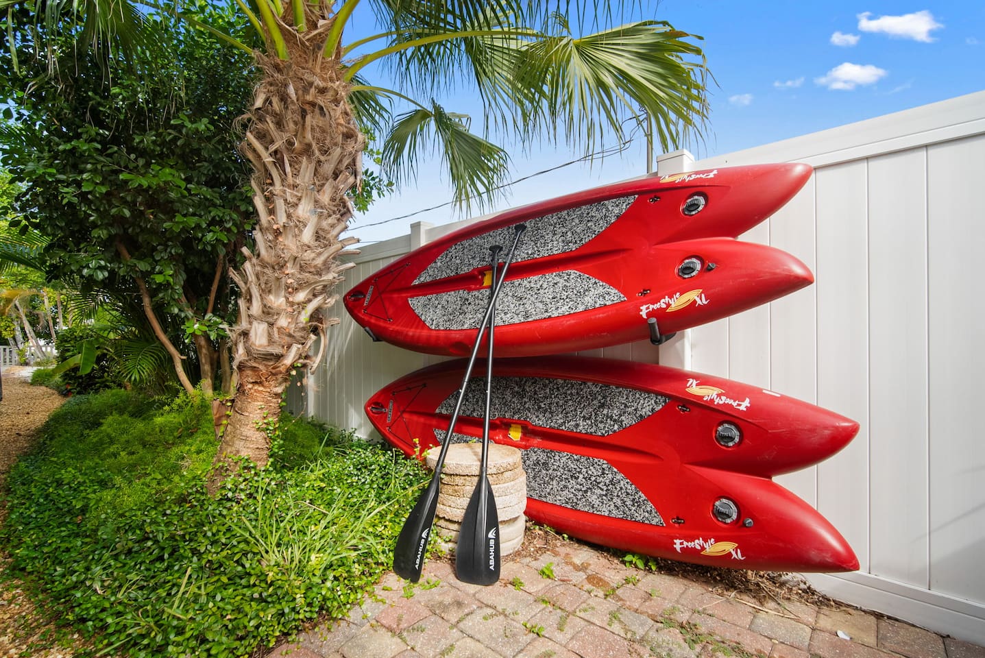 2 Paddle boards on the side of the house