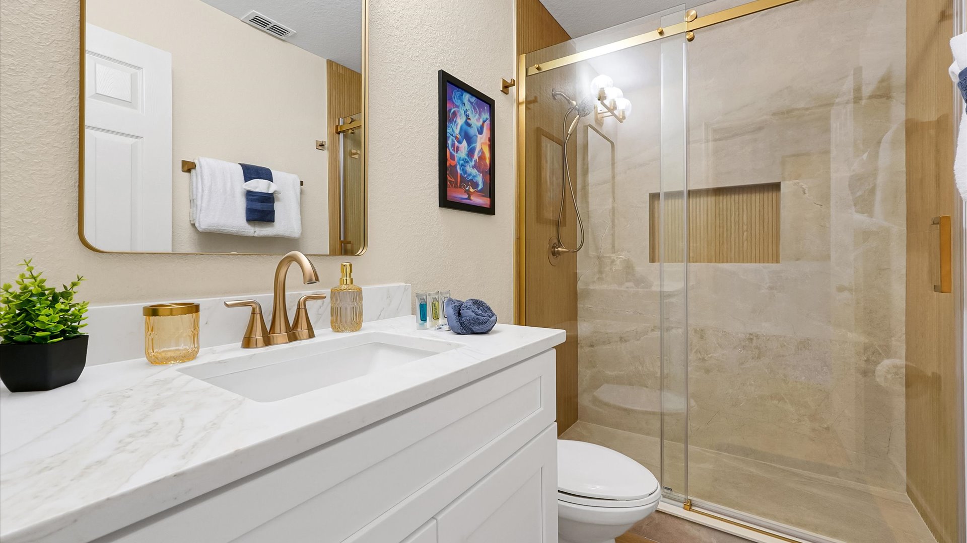 Aladdin King Suite Ensuite: Completely renovated ensuite with a custom-tiled walk-in shower, built-in niche and champagne-bronze finishes.