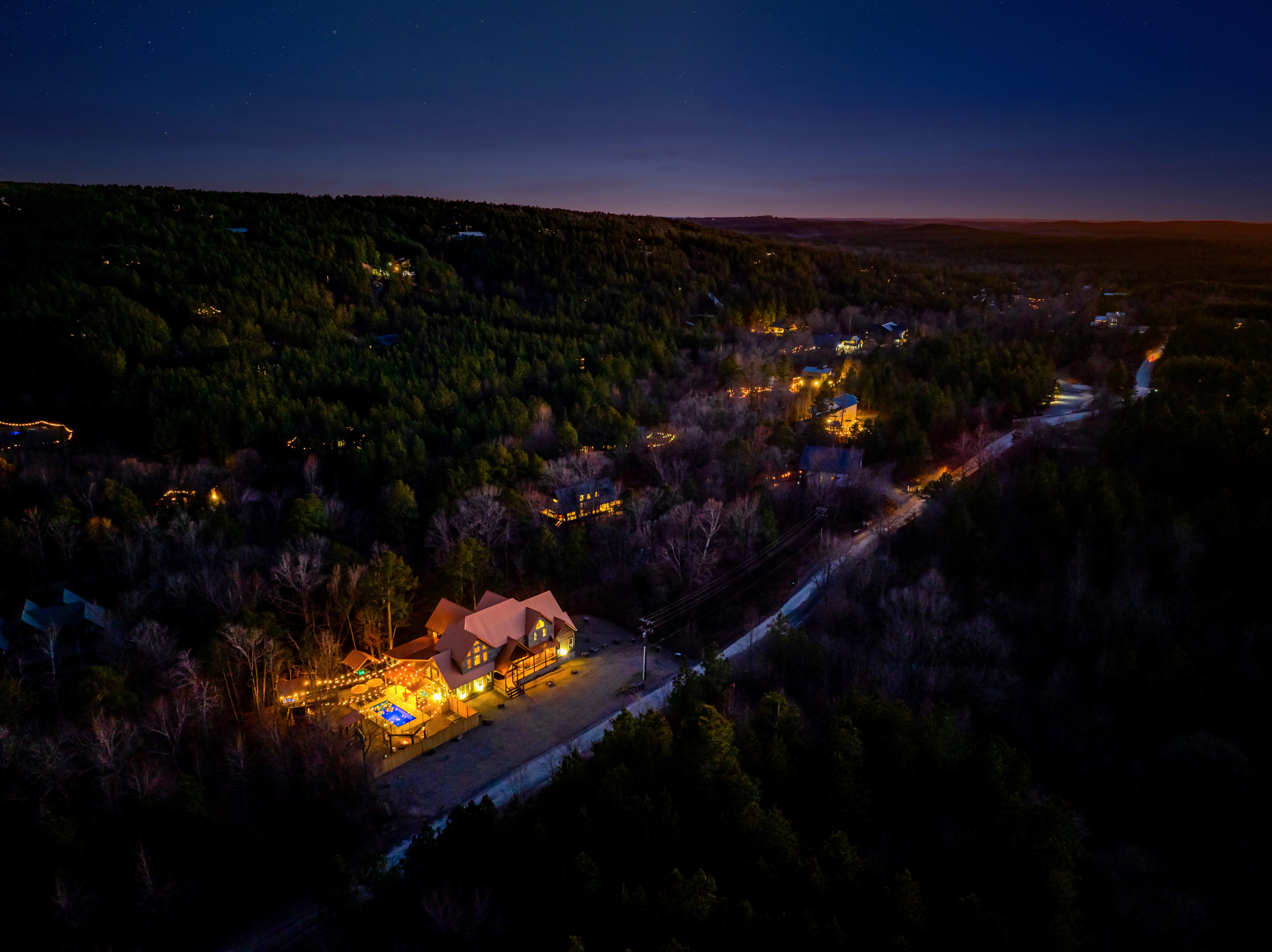 Exterior View: Enchanting nights await! Discover stunning views and twinkling lights in nature.