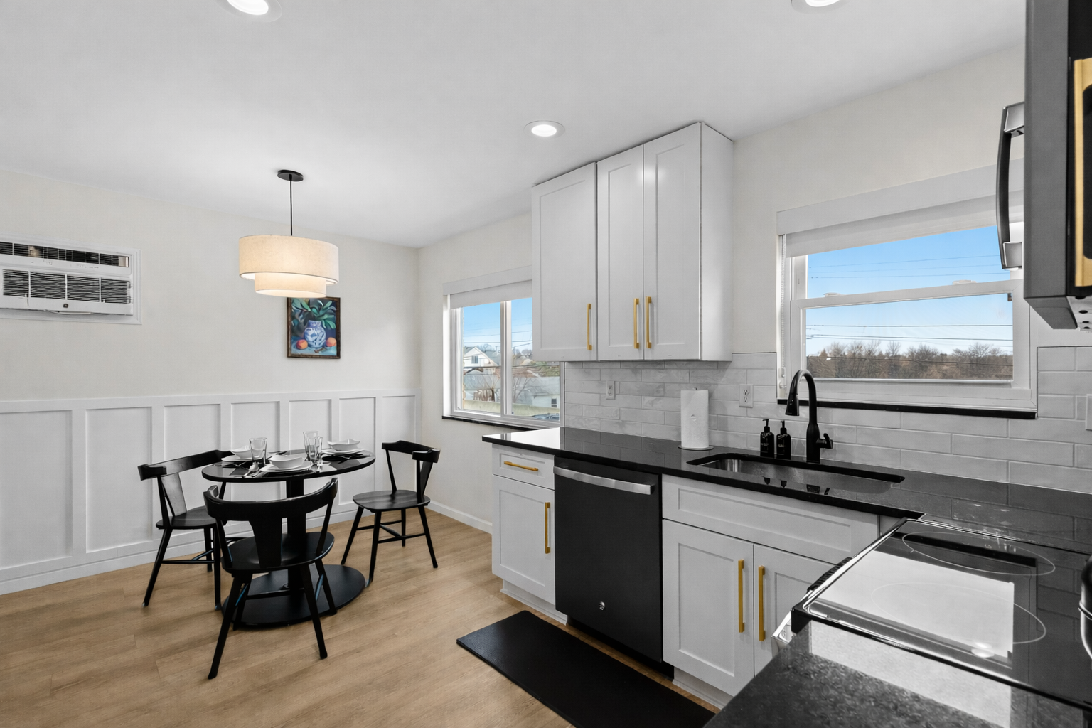 Bright kitchen and dining area with modern finishes, ample counter space, and natural light—perfect for cooking, dining, and everyday comfort.
