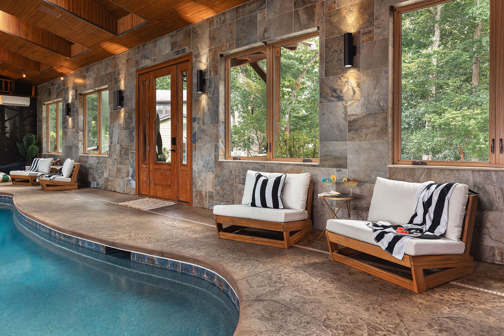 {Indoor Pool House} Poolside loungers and walls of windows create an easy place to relax while the rest of the group swims and plays.