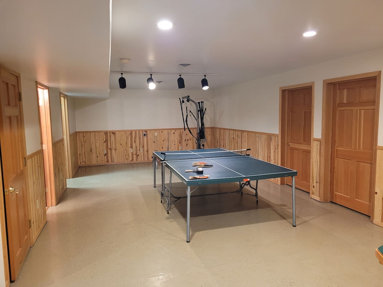 Ping pong table and BowFlex machine. The two fold out cots can be set up in here as well. 