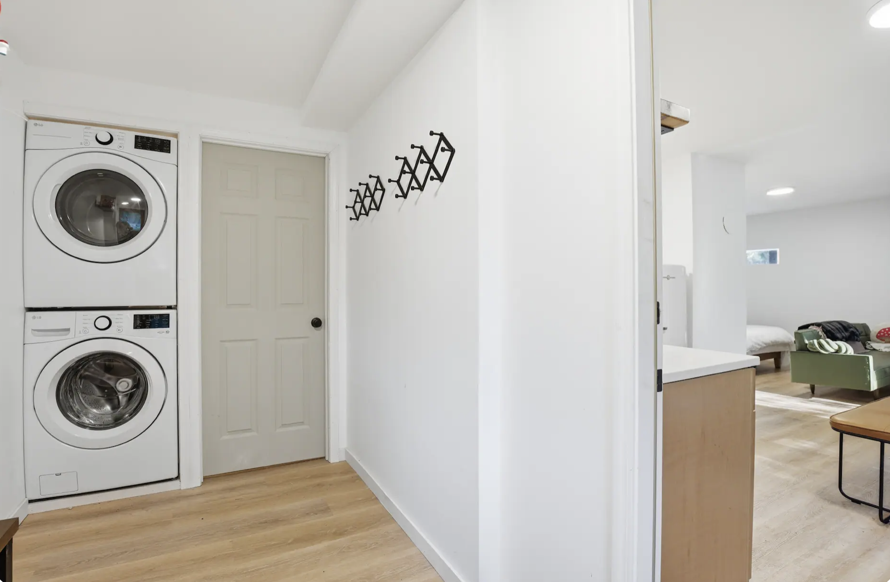 A second washer and dryer located in the studio style suite downstairs.