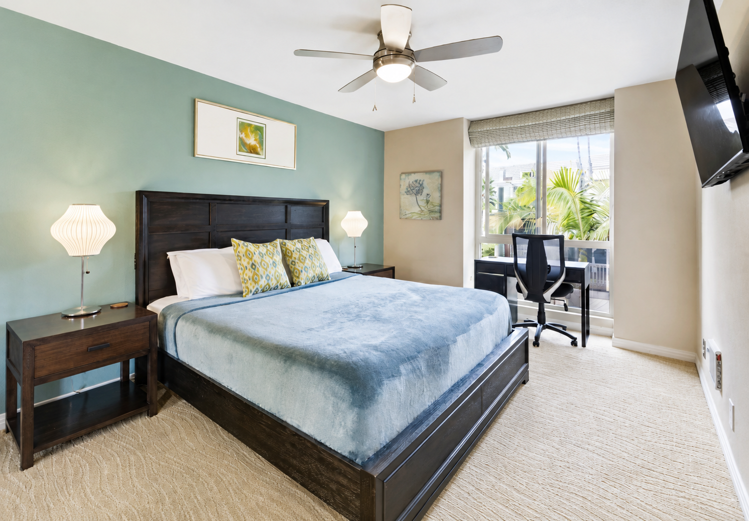 King-size bed with European blackout curtains and built-in charger ports