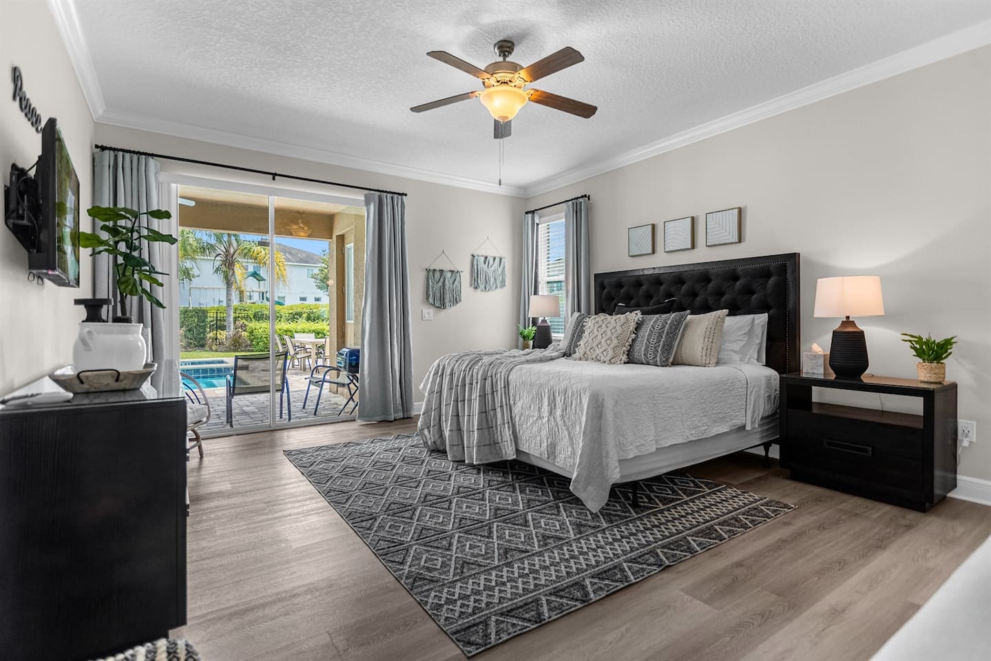 Serene peace-themed bedroom boasting a king-size bed, adorned with peaceful accents and soft textiles, offering a cozy and calming atmosphere for a restful stay.